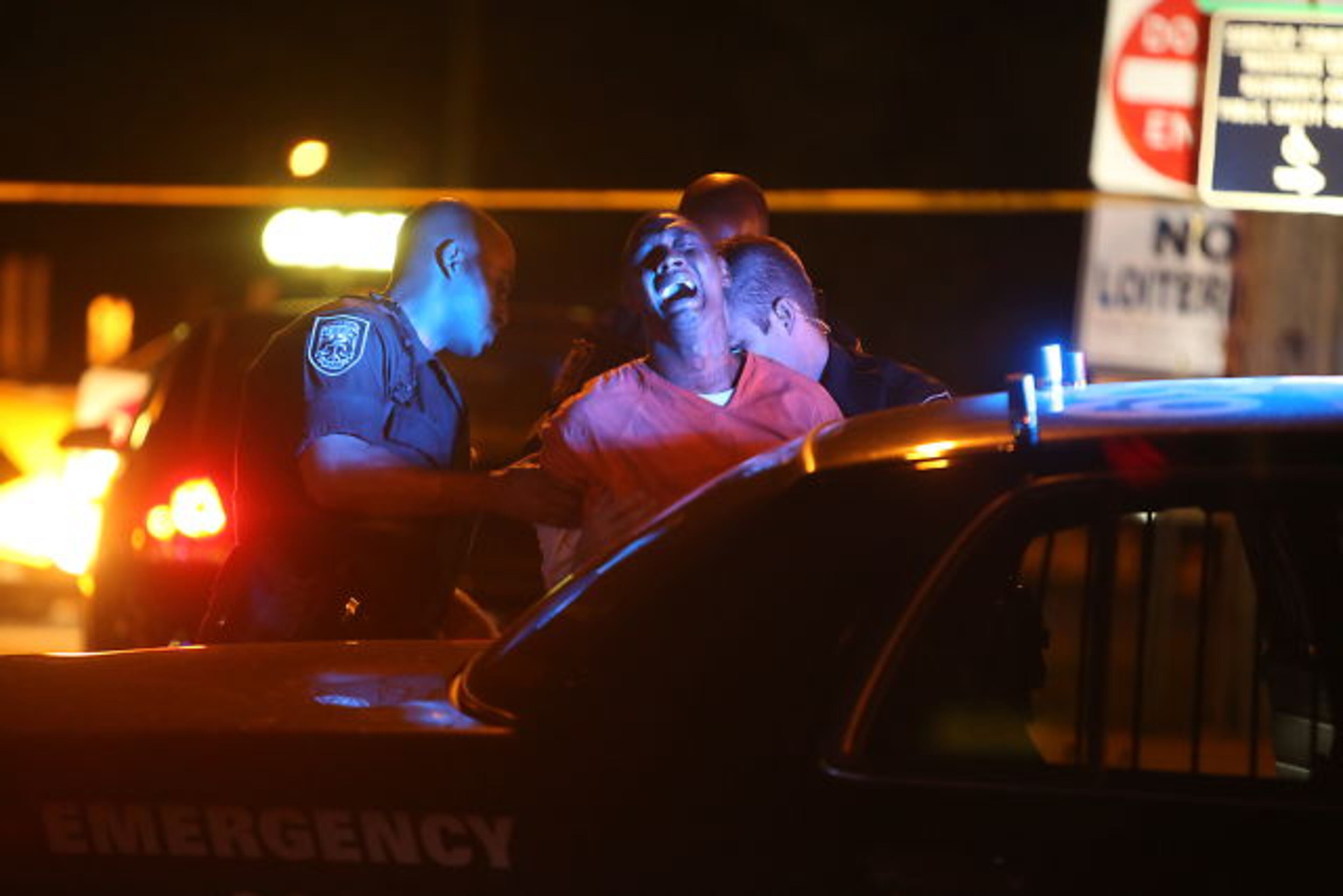 Officers also interviewed an inmate in an orange jumpsuit briefly and then took him away in a police car after a DeKalb County police officer and an inmate were shot outside the DeKalb County Magistrate Court on Oct. 2, 2014.