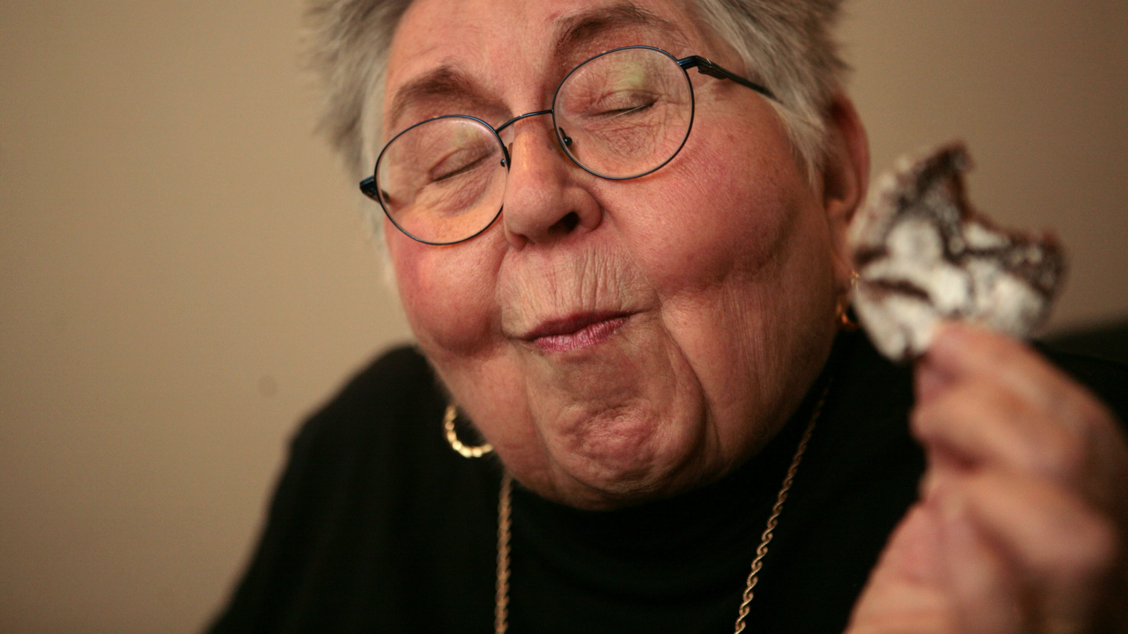 081110 ATLANTA, GA - During a portrait session, Atlantan chemist and cookbook author Shirley Corriher takes a bite of a chocolate crinkle cookie, closes her eyes and says "Mmmmm," on November 10, 2008. Corriher made a book signing appearance with Food Network's Alton Brown at the Margaret Mitchell House on November 10, 2008. Corriher is the author of "CookWise" and the newly released "BakeWise." JESSICA MCGOWAN / jmcgowan@ajc.com