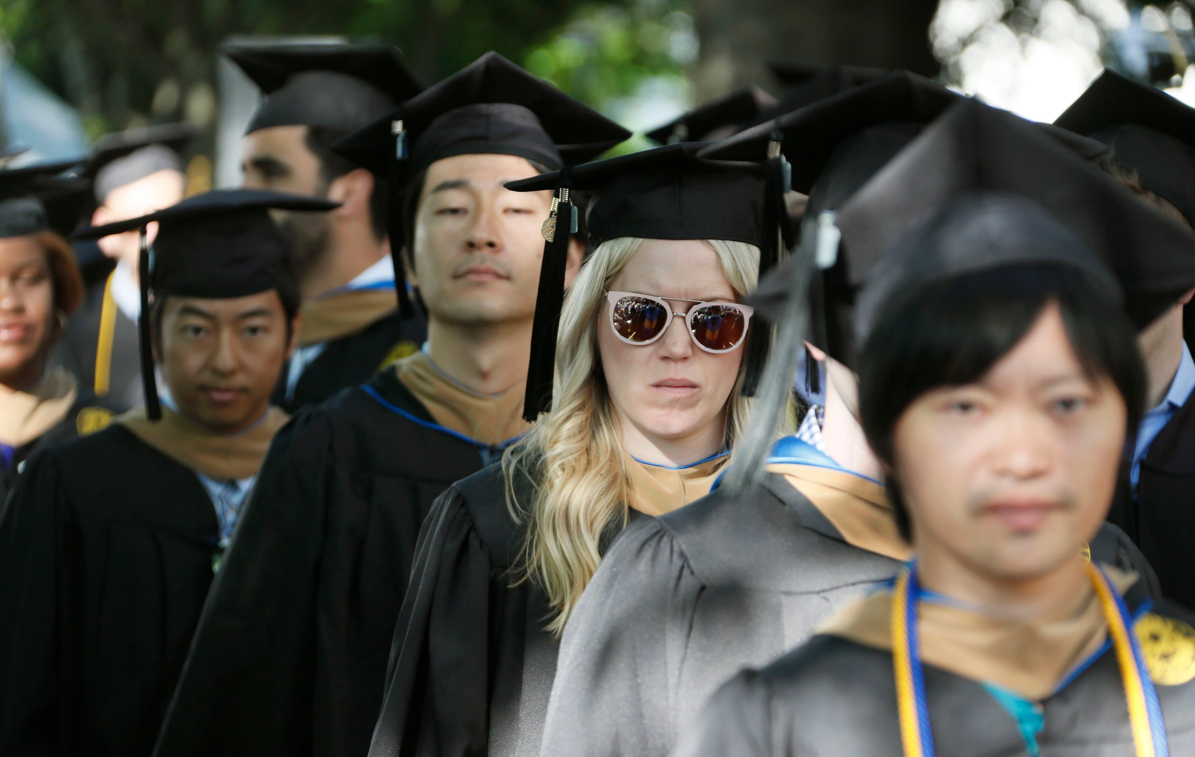 Graduates faces display a variety of emotions as they enter the quad during the processional. Claire E. Sterk, the university's 20th president, presided over the 174th commencement exercises on Monday, May 13, 2019. Andrew Young, former Atlanta mayor and civil rights activist, delivered the keynote address. Bob Andres / bandres@ajc.com