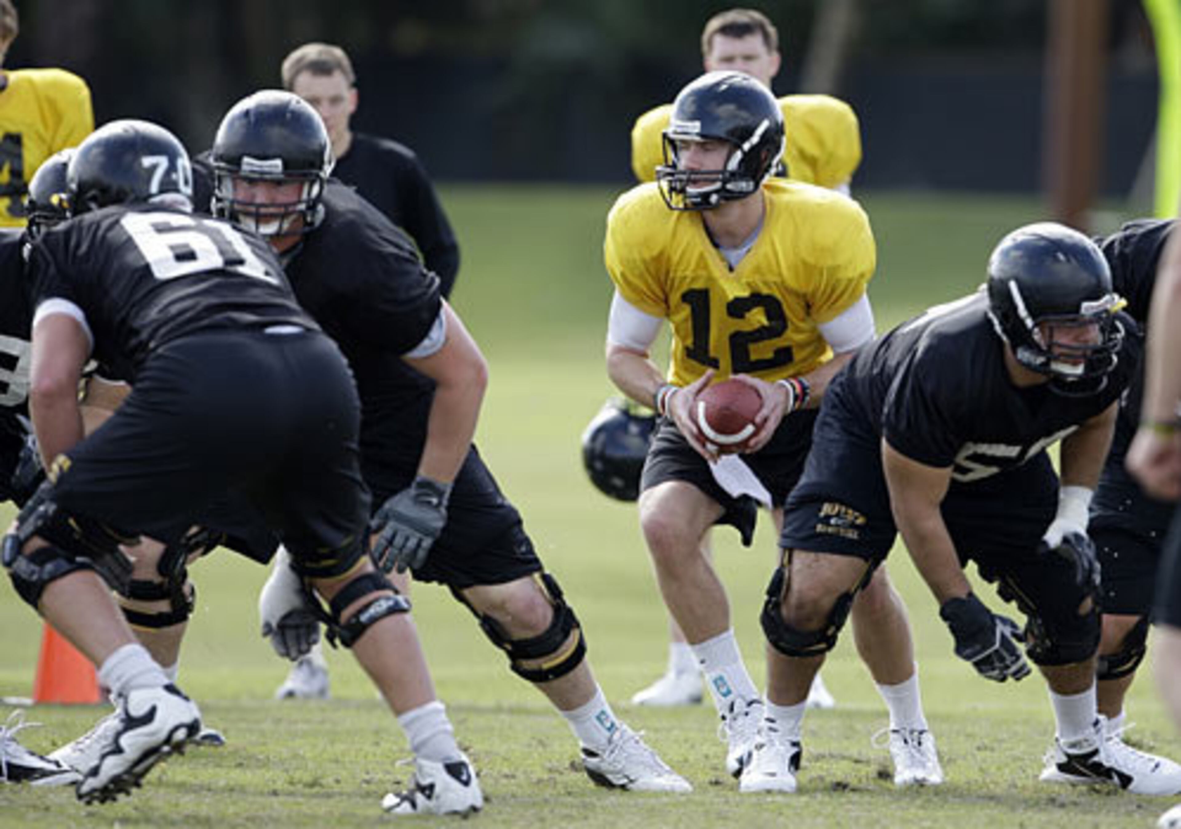 Iowa QB Ricky Stanzi (12) and the Hawkeyes get in some practice for the Orange Bowl near Miami Dec. 30, 2009.