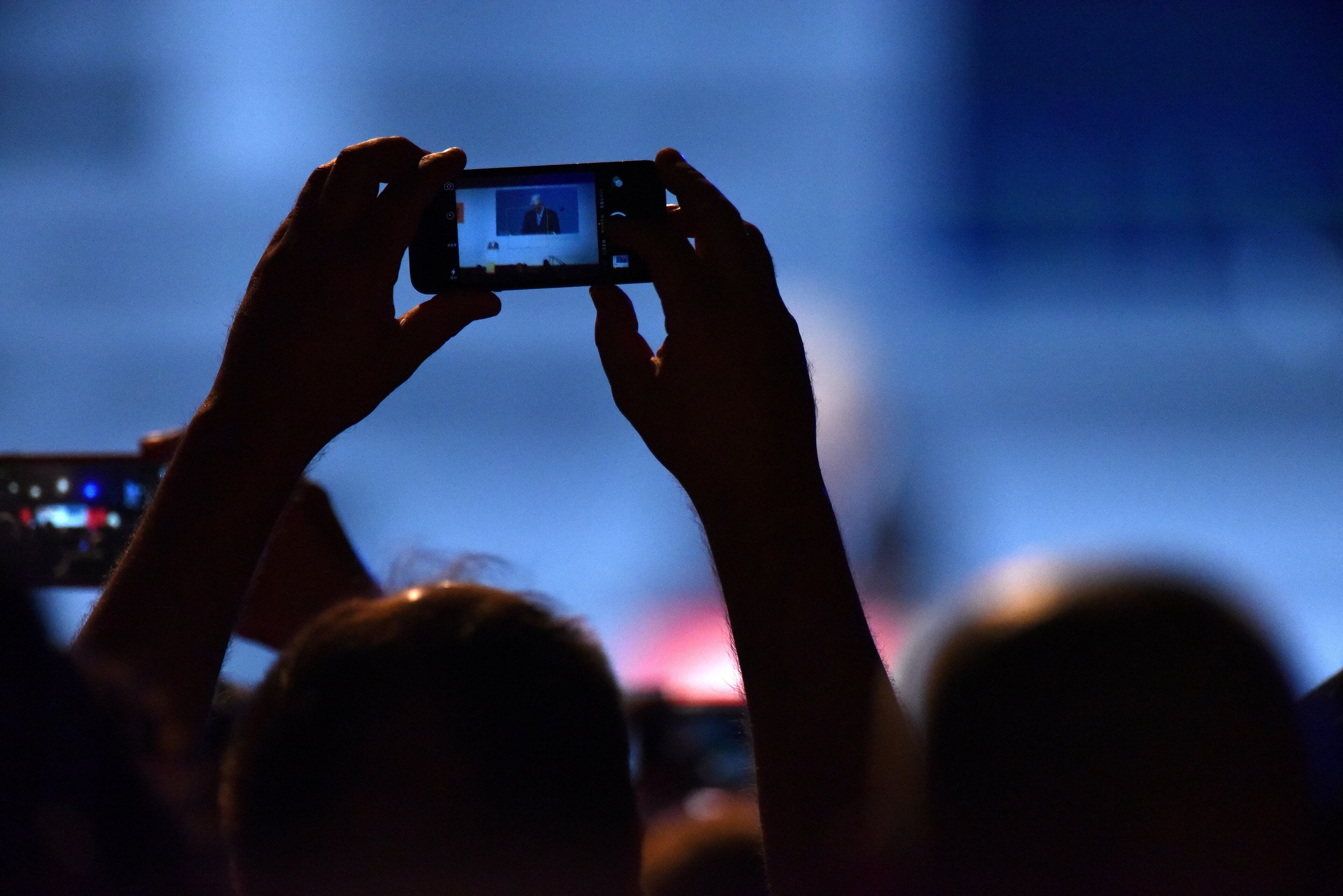 Participants take pictures with their smartphones as former President Bill Clinton is introduced for the keynote address during the 2015 AIA National Convention and Design Exposition at the Georgia World Congress Center on Thursday, May 14, 2015. HYOSUB SHIN / HSHIN@AJC.COM