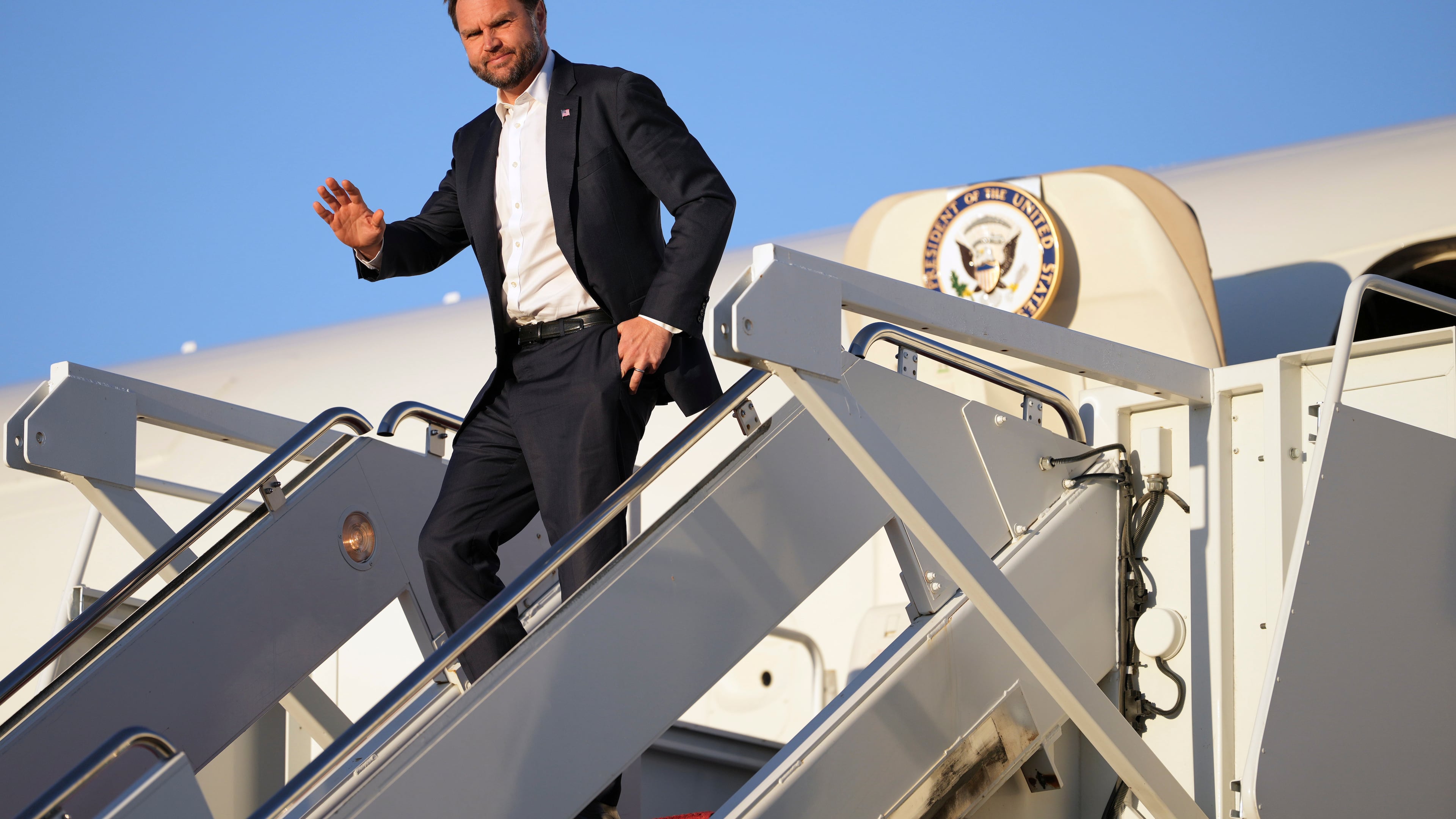 Vice President JD Vance waves as he arrives on Air Force Two, Monday, Sept. 14, 2026, at Joint Base Andrews, Md. (AP Photo/Mark Schiefelbein, Pool)
