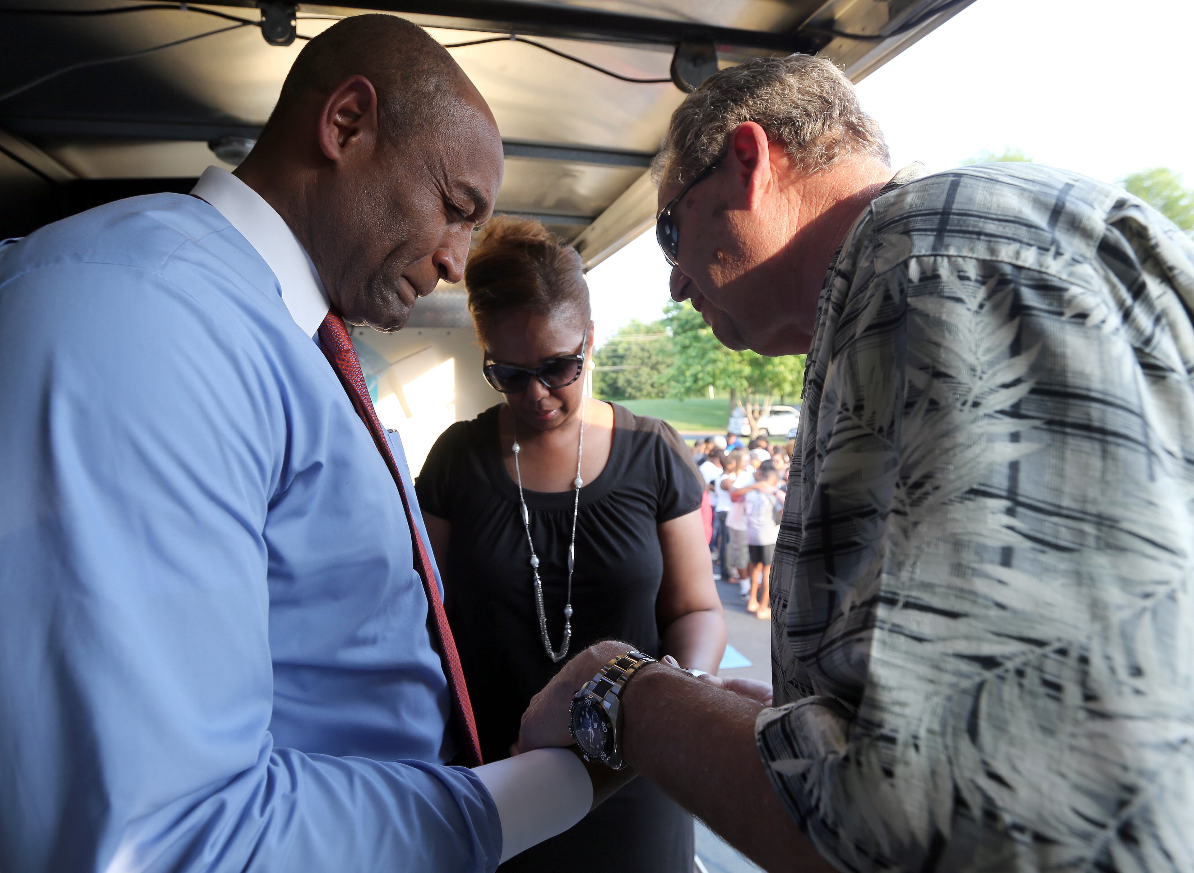 May 27, 2014 Roswell: Ed Grimes, left, an elder with World Harvest Church in Roswell, prays with Richard and Millicent Jones during a prayer vigil for the Jones son Ben who went missing after saying he was headed to pick up graduation tickets at Morehouse College. About two hundred friends, neighbors and fellow church members showed up for the Tuesday evening May 27, 2014 prayer vigil. BEN GRAY / BGRAY@AJC.COM