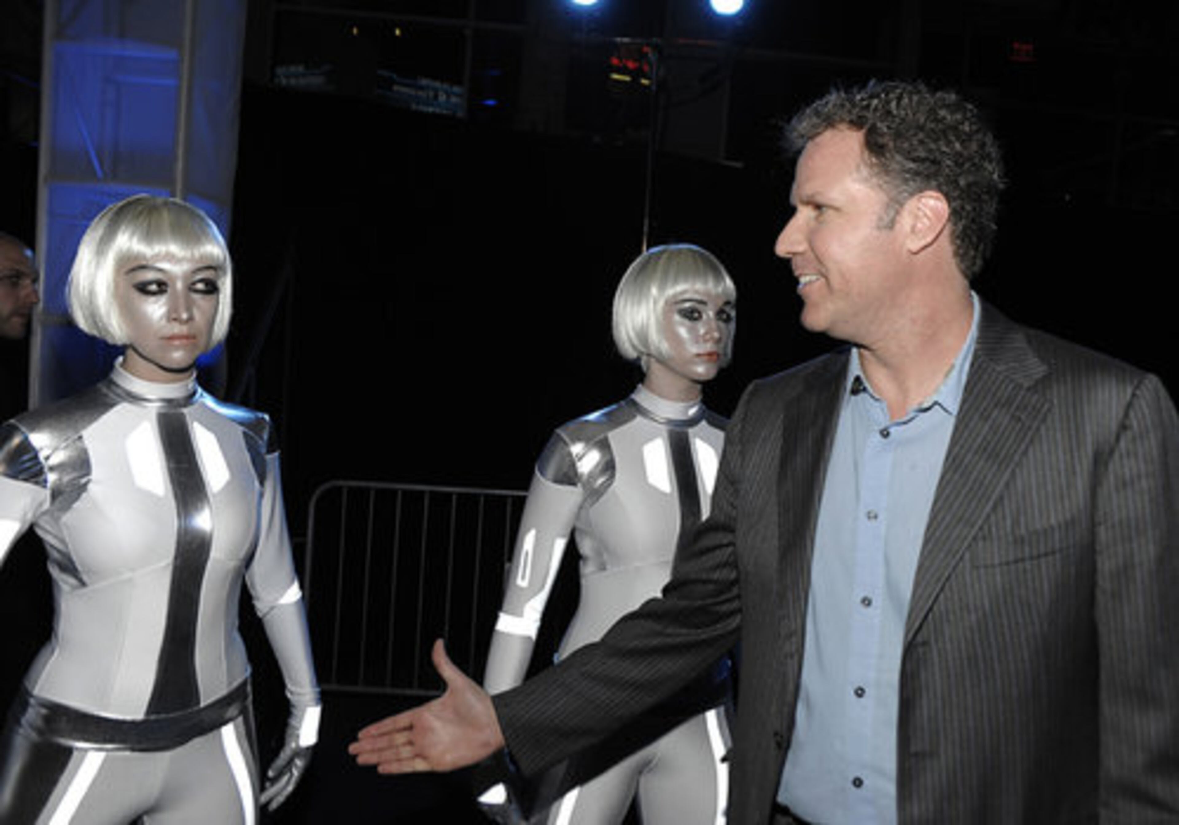 Actor Will Farrell tries to charm one of the white-clad "Sirens." Tom Cruise, Ana de la Reguera ("Cowboys and Aliens"), Patrick Fugit ("Almost Famous"), and Jena Malone ("Saved!") also attended.