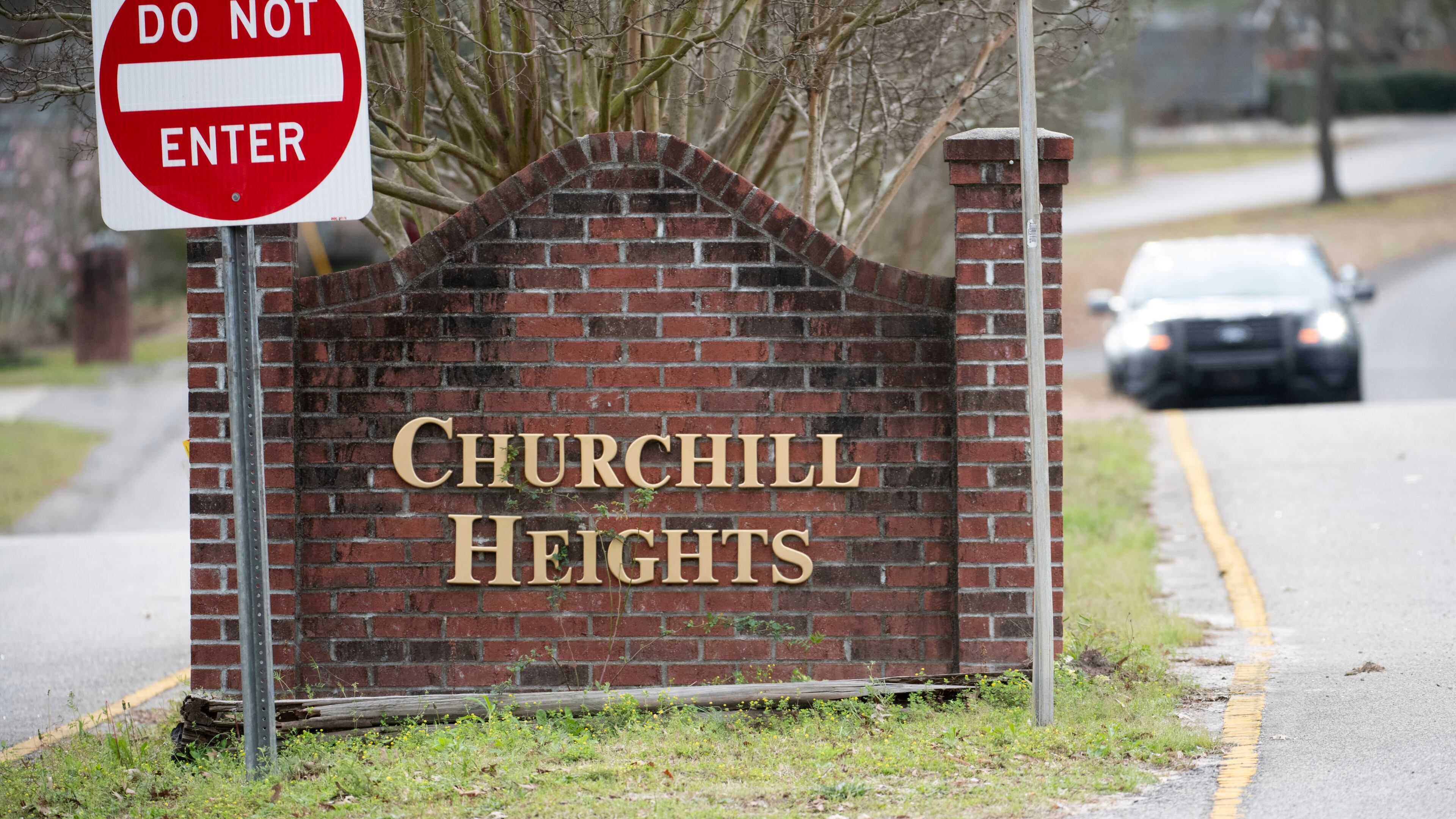 A police officer blocks a road near an entrance to the Churchill Heights neighborhood Thursday, Feb. 13, 2020, in Cayce, S.C., where 6-year-old Faye Marie Swetlik recently went missing just after getting off a school bus. Hundreds of officers in Cayce, along with state police and FBI agents, are working around the clock to try to find Swetlik, who was last seen Monday, Cayce Public Safety Officer Sgt. Evan Antley reiterated Thursday. (AP Photo/Sean Rayford)