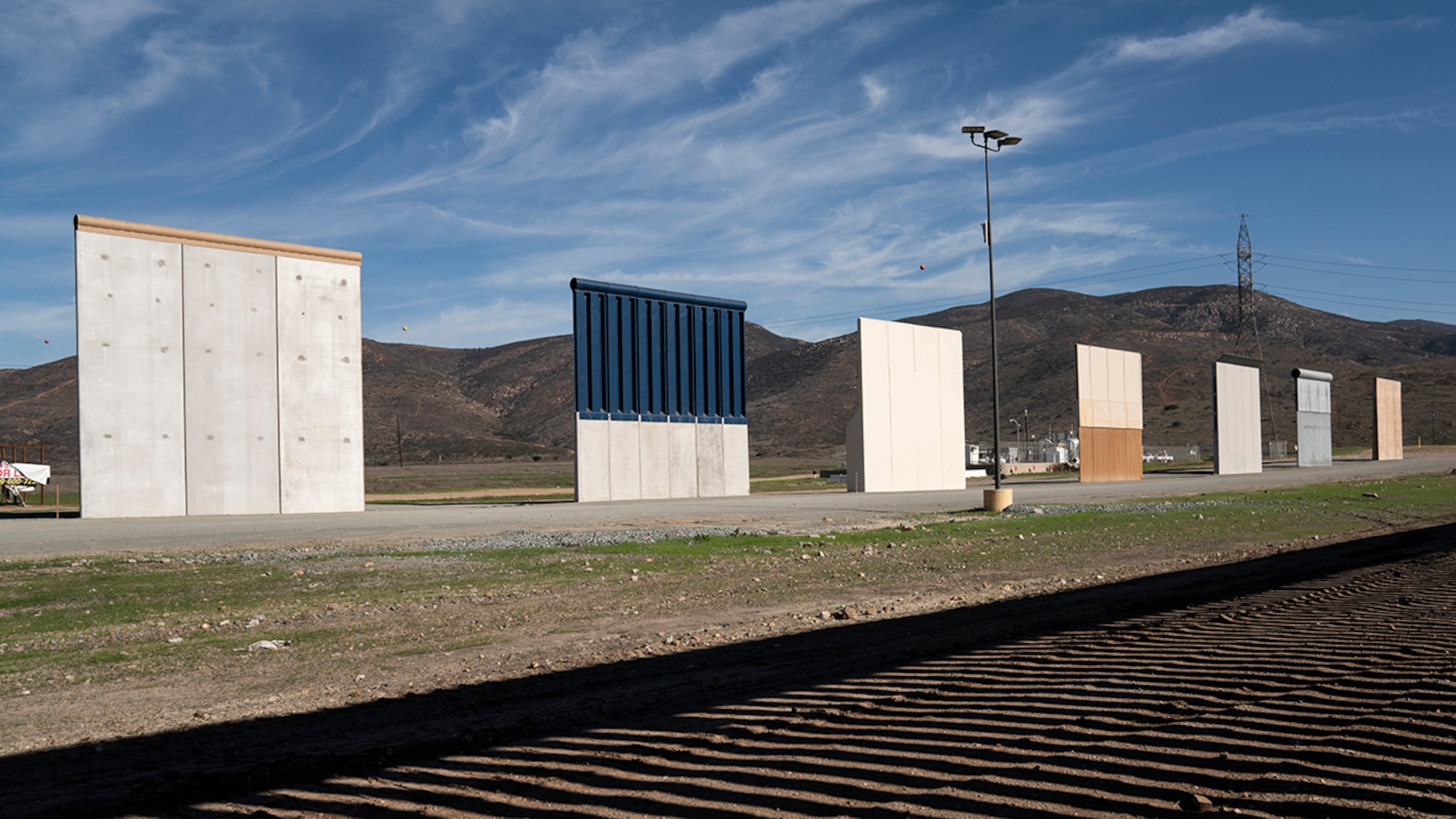 Border wall prototypes stand in San Diego near the Mexico U.S. border, seen from Tijuana, Saturday, Dec. 22, 2018. The U.S. federal government remains partially closed in a protracted standoff over President Donald Trump's demand for money to build a border wall with Mexico.