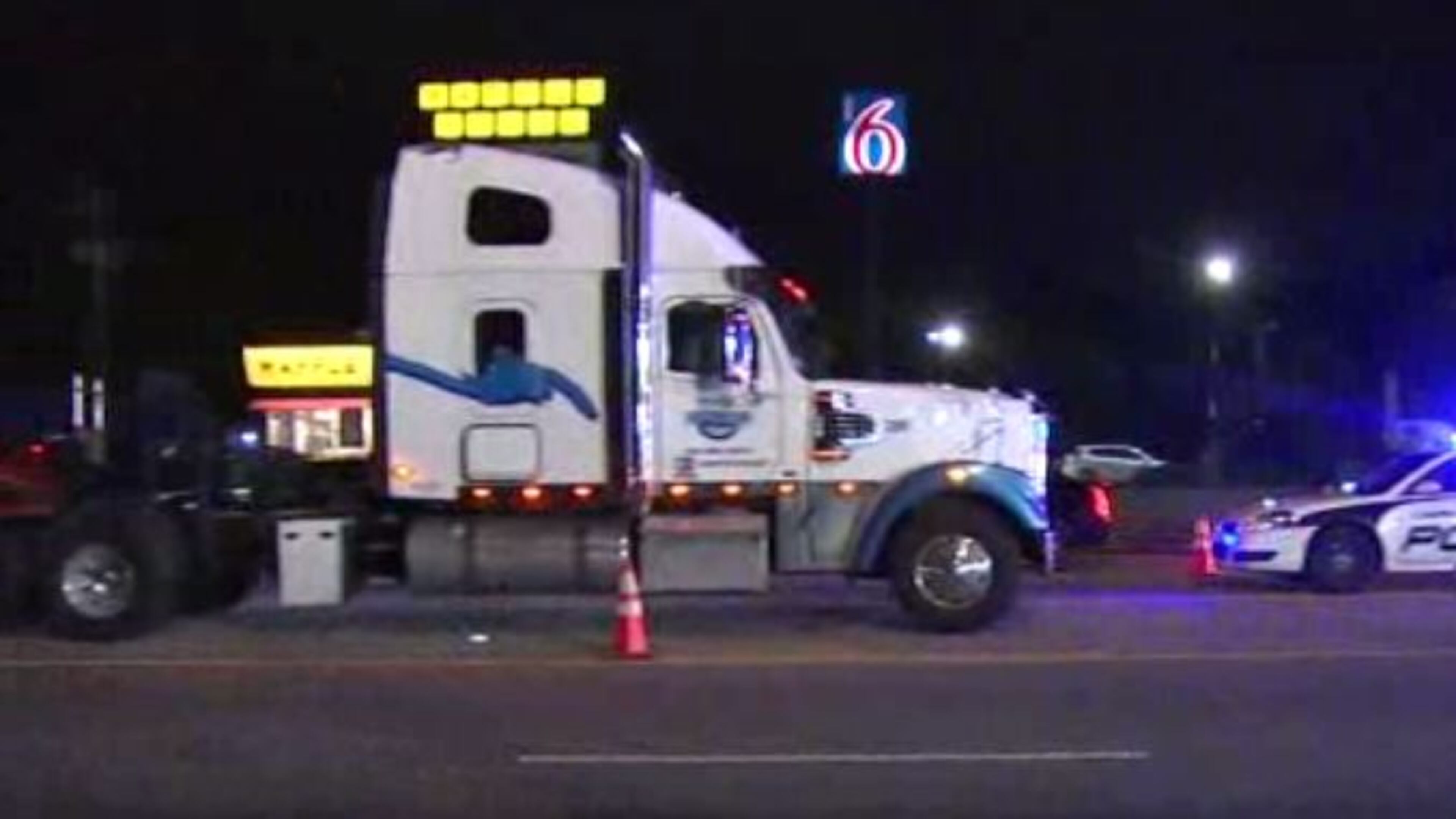 The semitruck was turning left onto I-85 when it hit the motorcycle, according to South Fulton police.