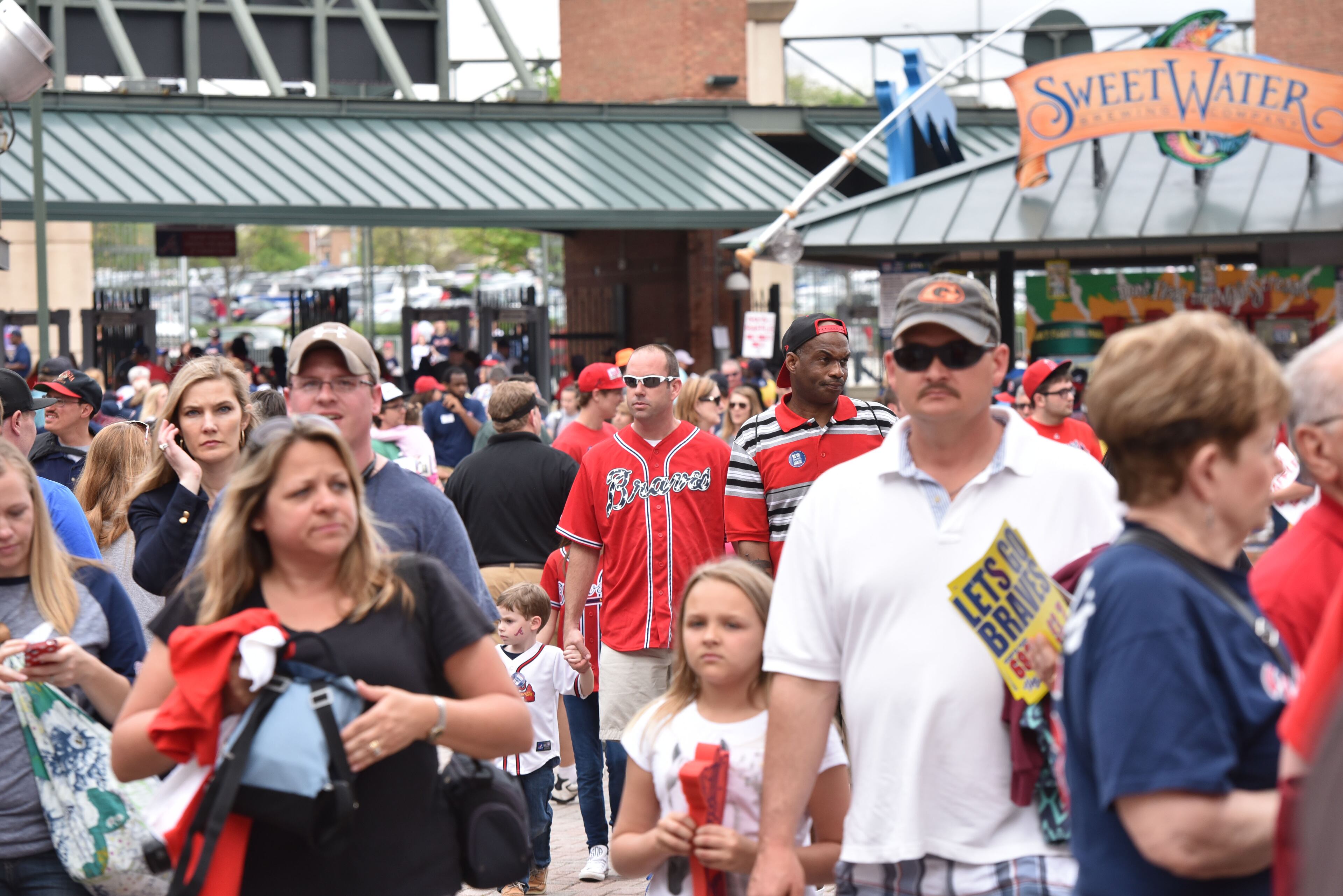 Atlanta Braves fans walk into the ball park before the Atlanta Braves season opener against the New York Mets at Turner Field in Atlanta on Friday, April 10, 2015. HYOSUB SHIN / HSHIN@AJC.COM