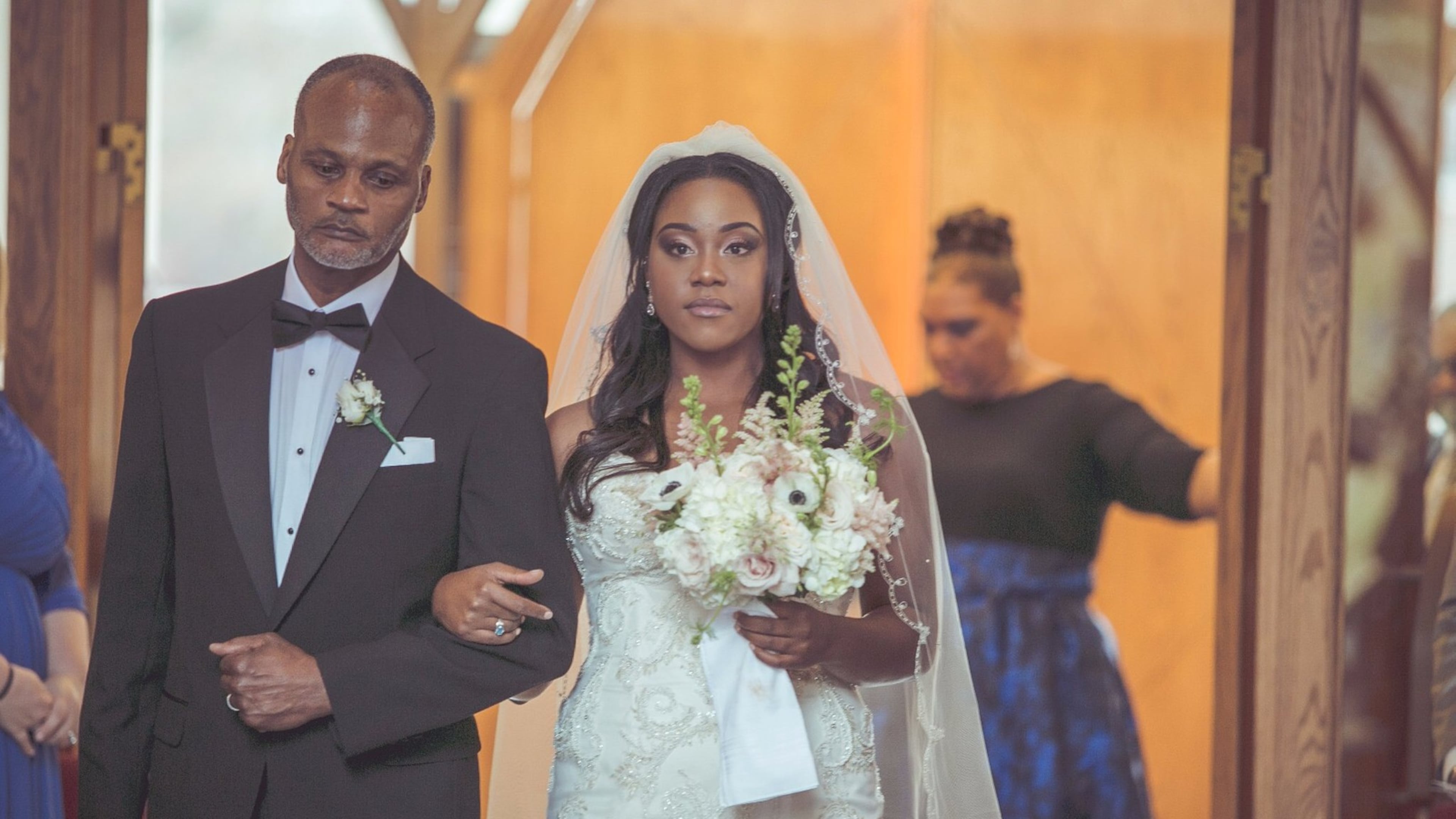 Asha Staples is escorted down the aisle by her father, Jimmy Staples. She wed Herman Hall Jr. on March 18 at the Julia Thompson Smith Chapel on the campus of Agnes Scott College in Decatur. CONTRIBUTED BY DIEGO BRITO AND LANE COSTA