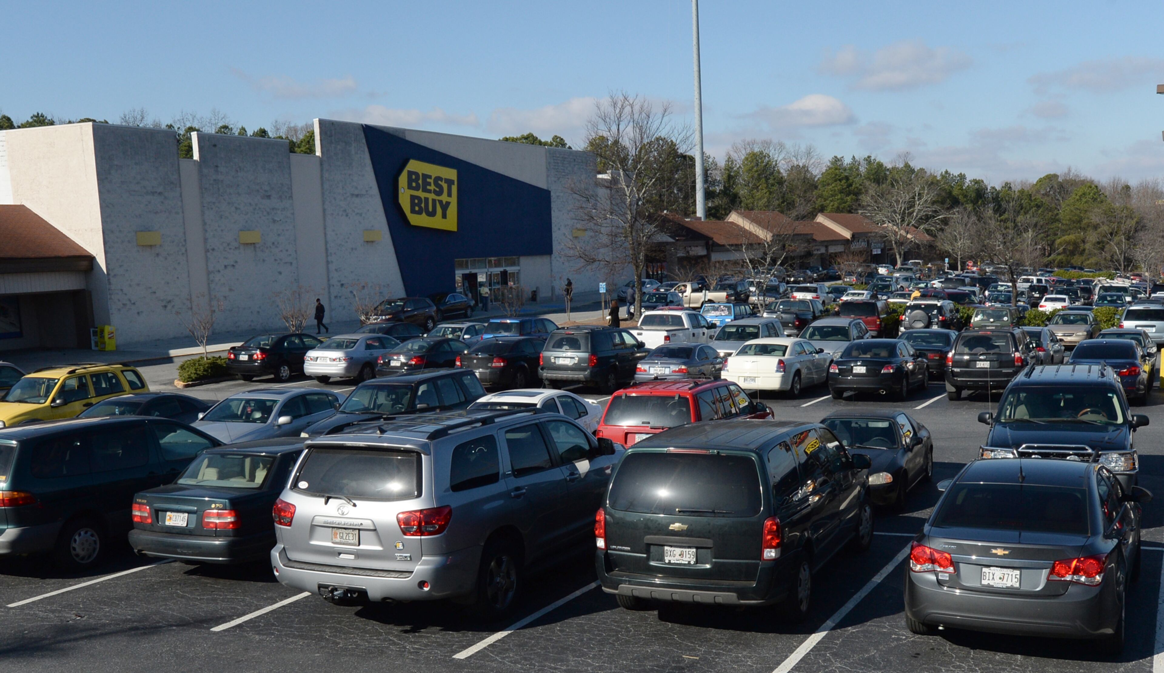 The parking lot at Best Buy on Cobb Parkway had few parking spaces as shoppers filled the store at noon on Tuesday, Dec. 24, 2013. Many people were shopping for bargains and last-minute Christmas gifts.