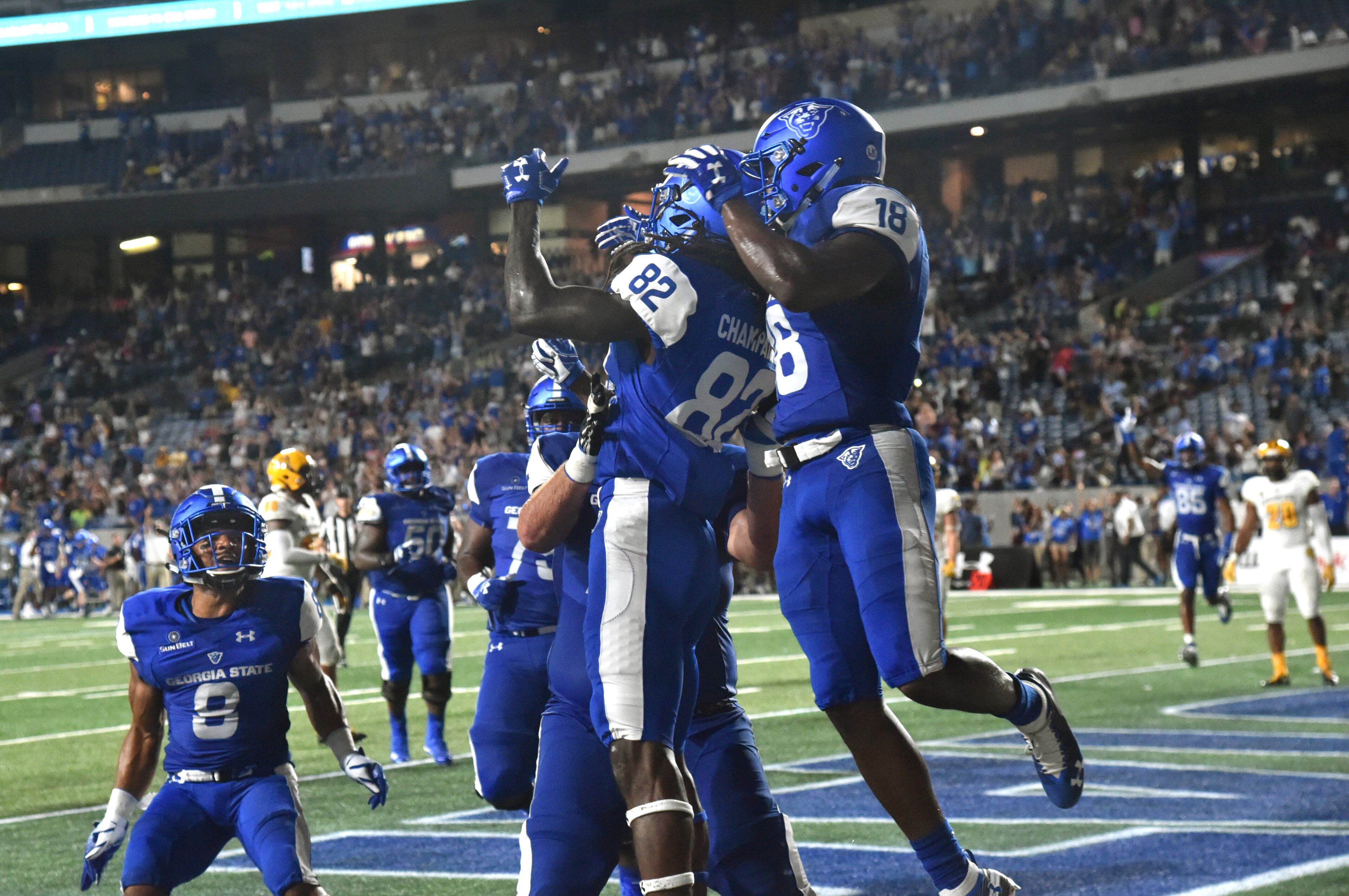 August 30, 2018 Atlanta - Georgia State wide receiver Diondre Champaigne (82) is congratulated by teammates after he made a game winning catch at the end of fourth quarter during Georgia State season opening game against the Kennesaw State at Georgia State Stadium on Thursday, August 30, 2018. Georgia State won 24-20 over the Kennesaw State. HYOSUB SHIN / HSHIN@AJC.COM