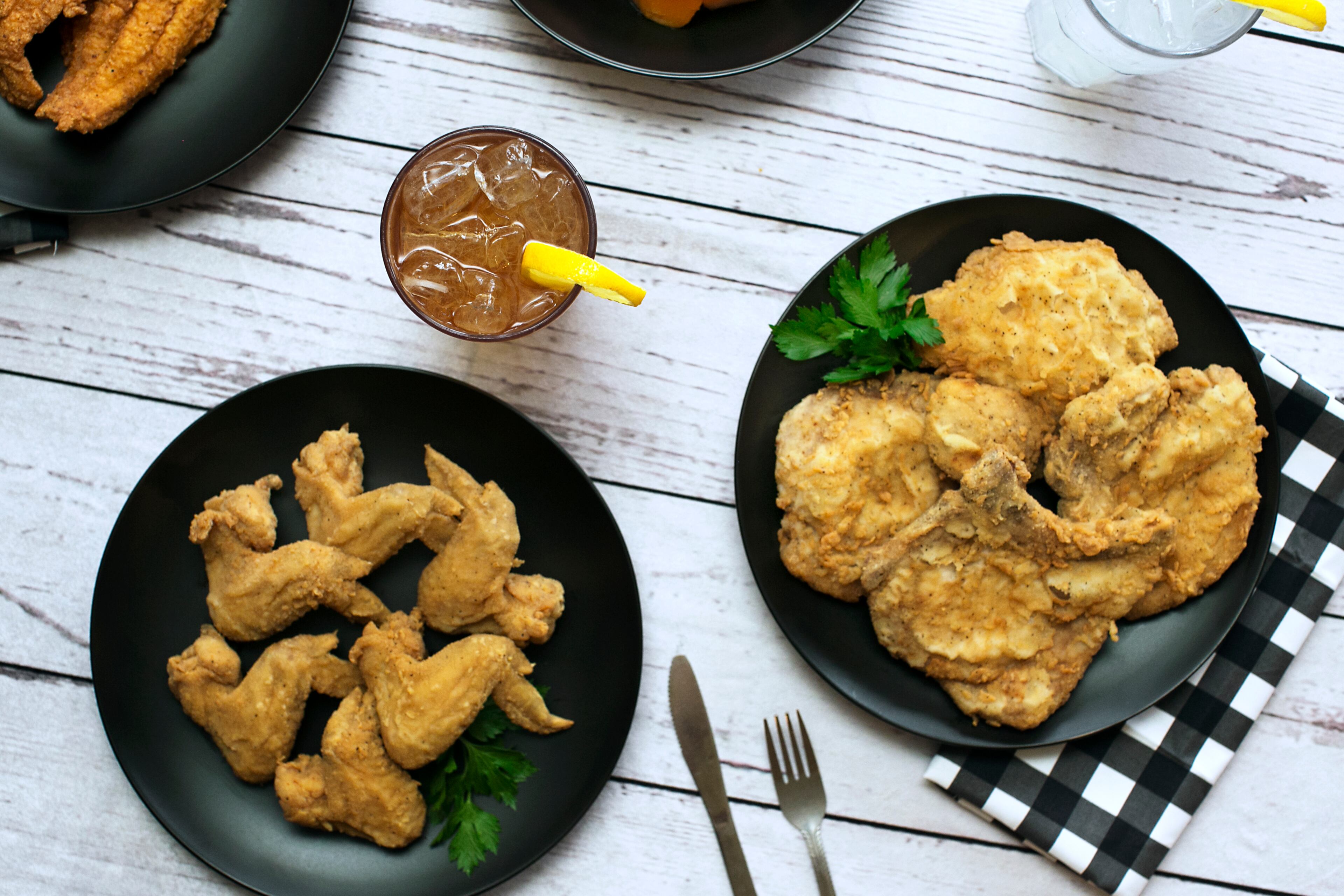 Chicken wings, iced tea, fried chicken and a pork chop are among the Southern classics at Busy Bee Cafe. Photo Courtesy of Morgen Purcell/Lemon Brands