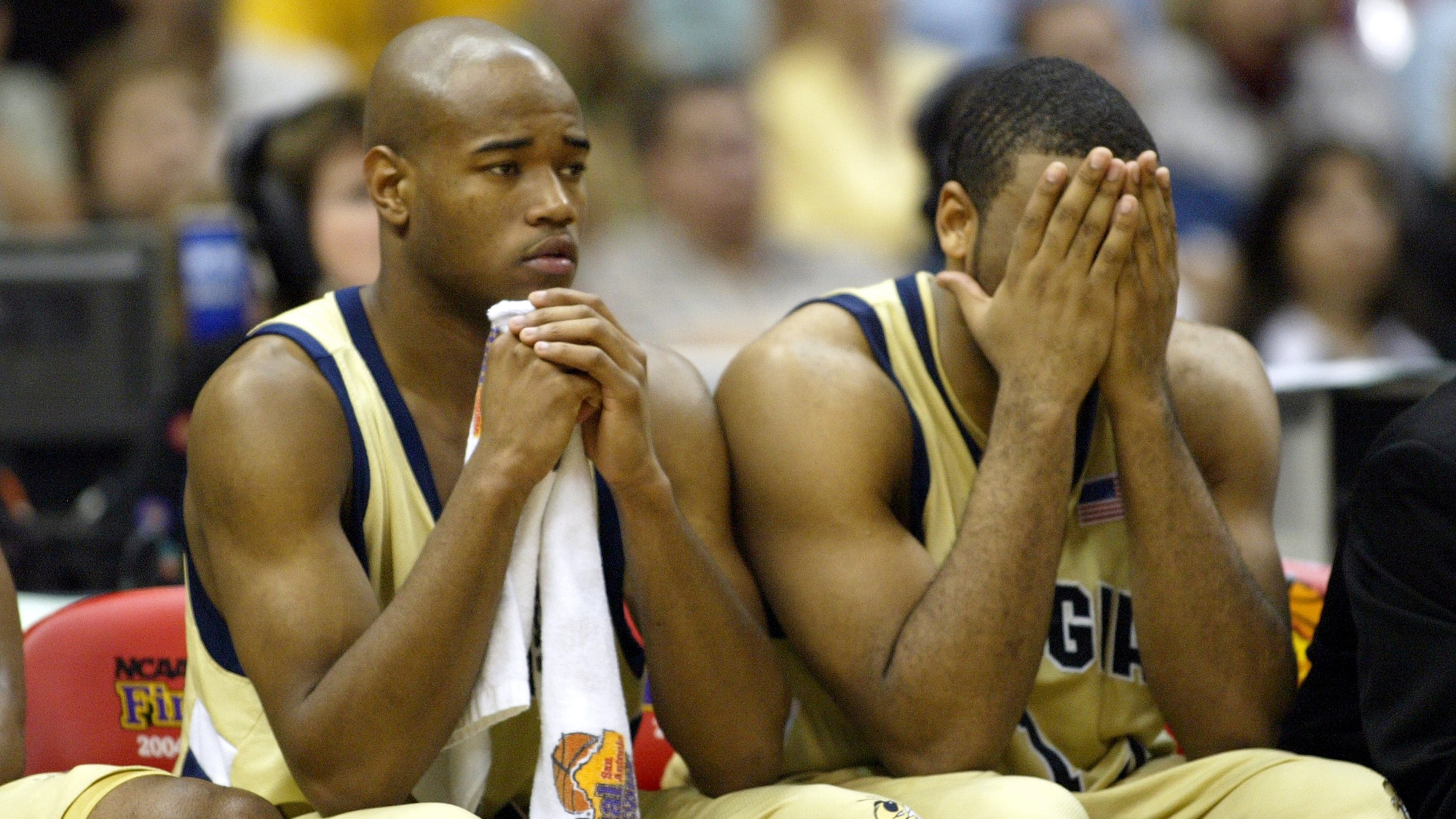 Georgia Tech's Jarrett Jack (left) and B.J. Elder sit dejected on the bench in the second half of their national championship loss to UConn Monday, April 5, 2004, at the Alamodome in San Antonio.