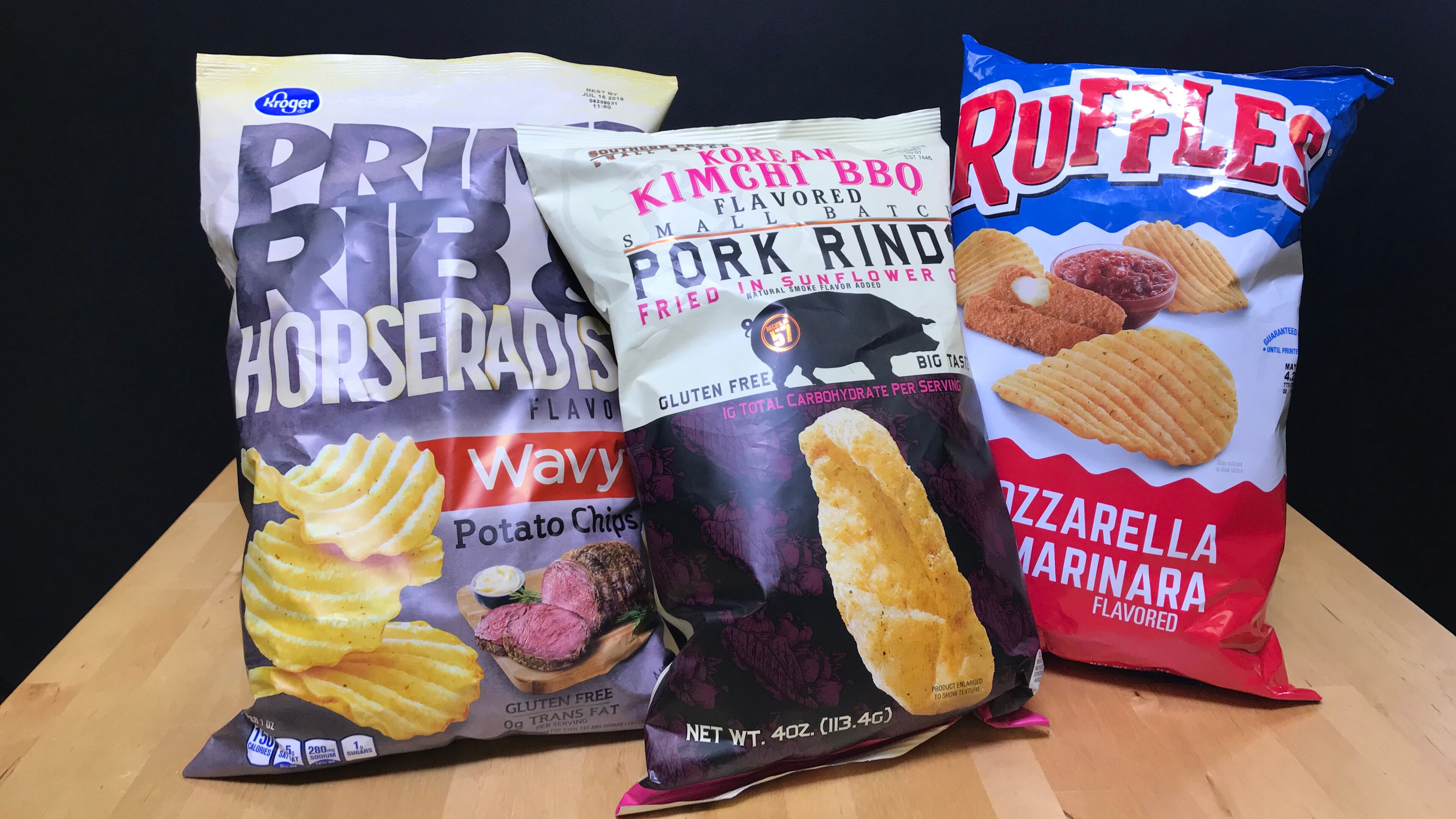 Kroger's Prime Rib and Horseradish Chips, Southern Recipe Small Batch's Korean Kimchi BBQ Pork Rinds and Ruffles Mozzzrella Marinara Chips / Photo by Erica Hernandez