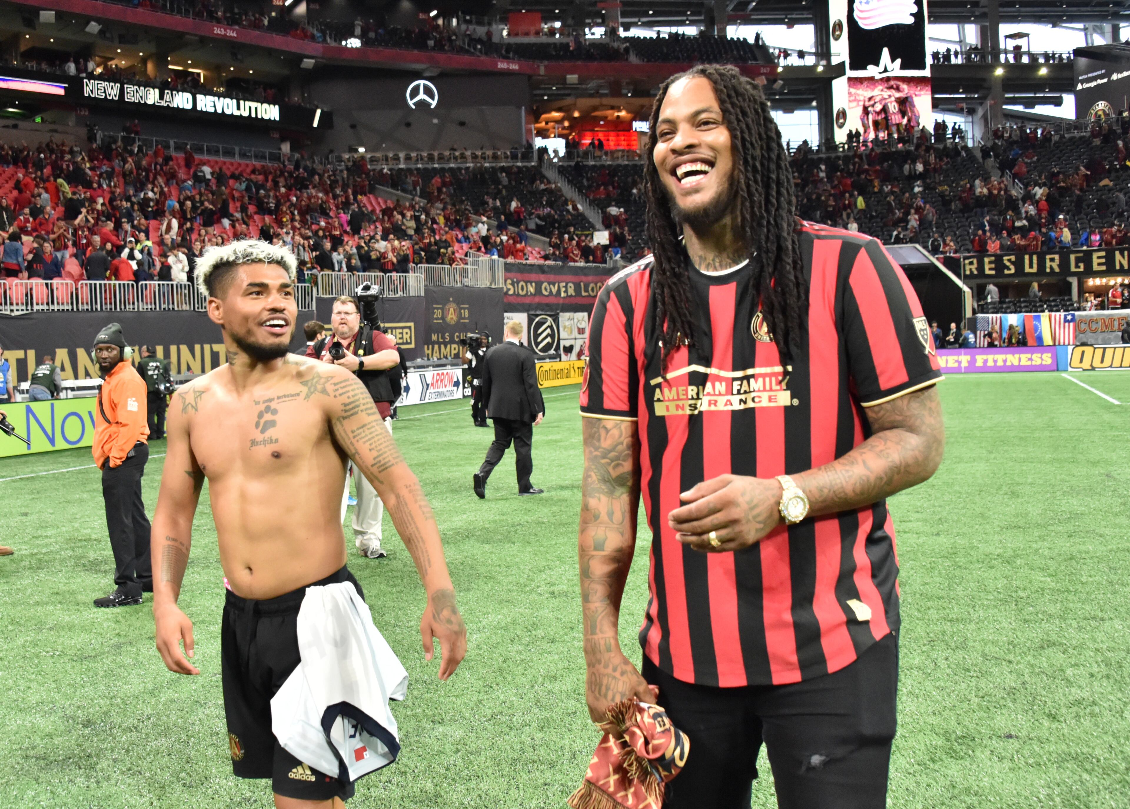 Atlanta United forward Josef Martinez (left) celebrates with rapper Waka Flocka Flame after Atlanta United defeated the New England Revolution in the first round of the MLS playoffs at Mercedes-Benz Stadium on Saturday, October 19, 2019. Atlanta United won 1-0 over the New England Revolution. (Hyosub Shin / Hyosub.Shin@ajc.com)