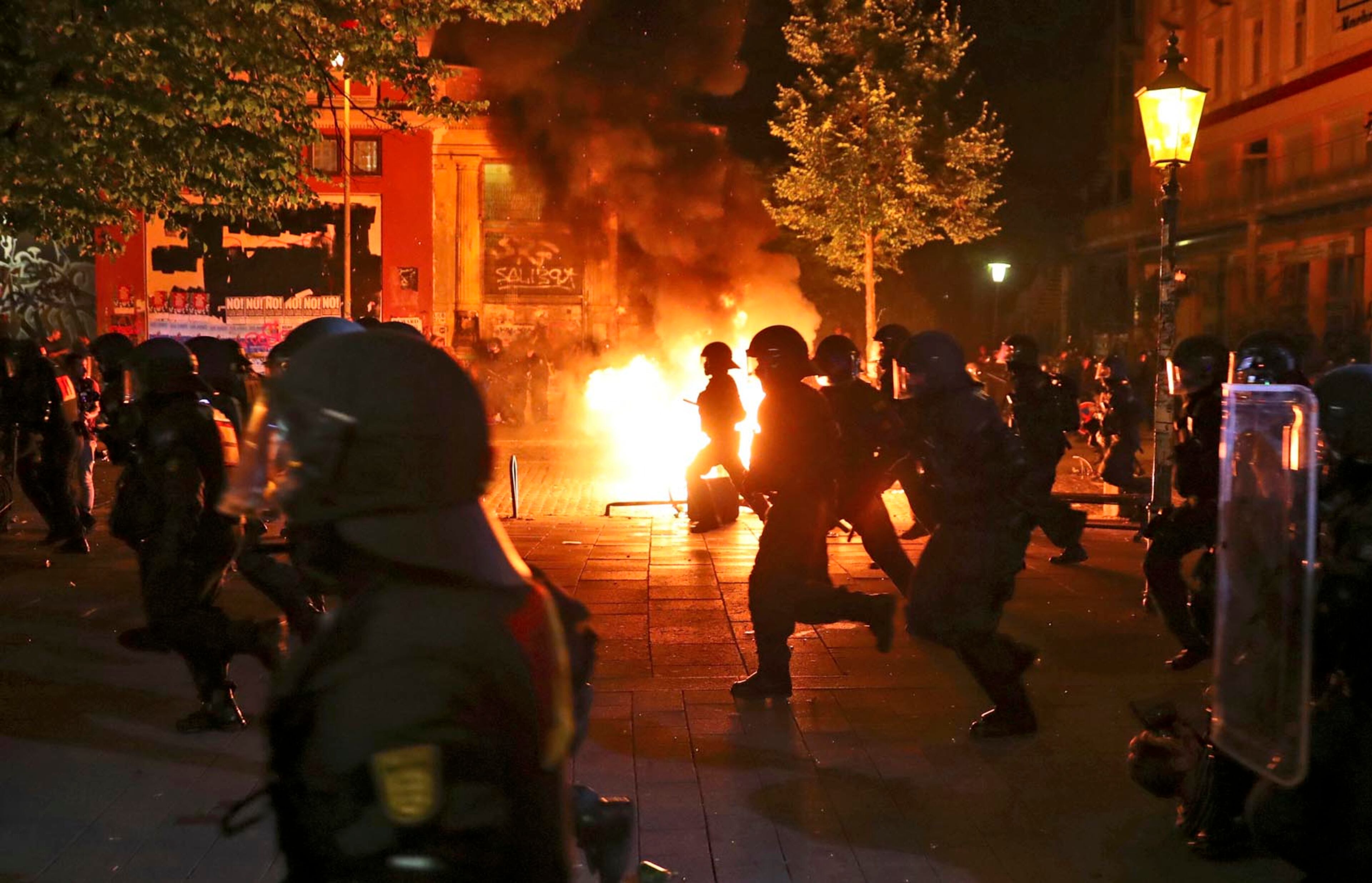 Police officers in operation during the protest against the upcoming G20 summit in Hamburg, Germany, Thursday July 6, 2017. The leaders of industrialised nations, G20, are holding a two day summit starting Friday in Hamburg. (Christian Charisius/dpa via AP)