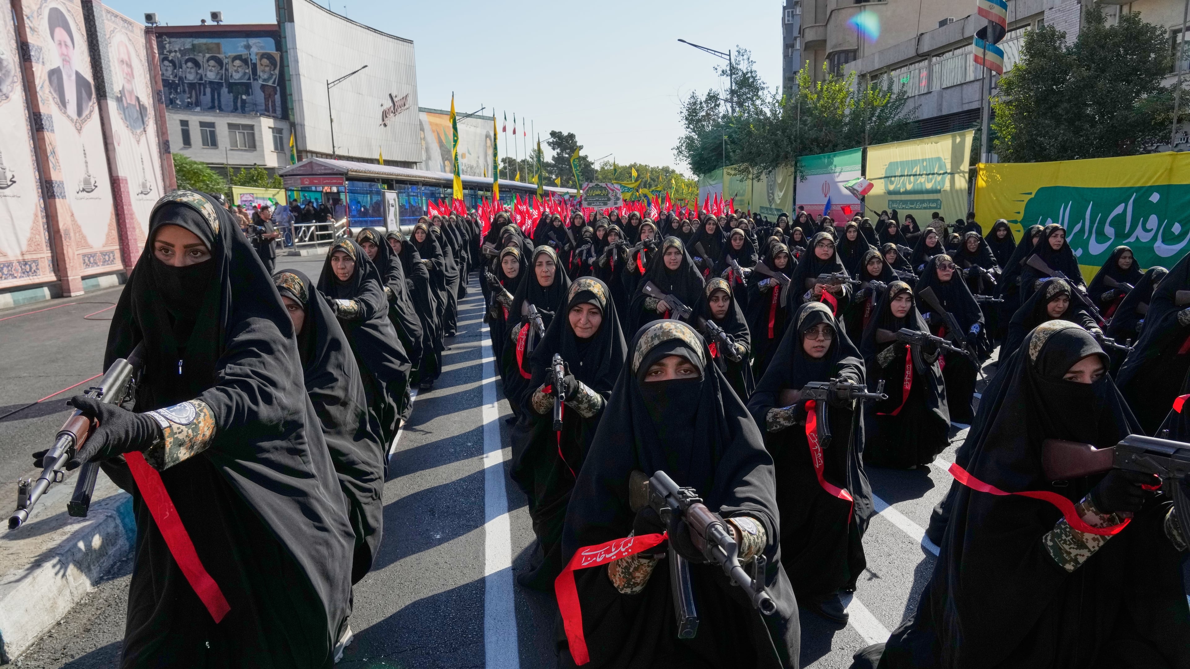 Women affiliated with Iran's Revolutionary Guard carry rifles as they stand during the state-organized "Janfada," or "Sacrifice for Iran," military-style parade in Tehran, Iran, Friday, Sept. 18, 2026. (AP Photo/Vahid Salemi)