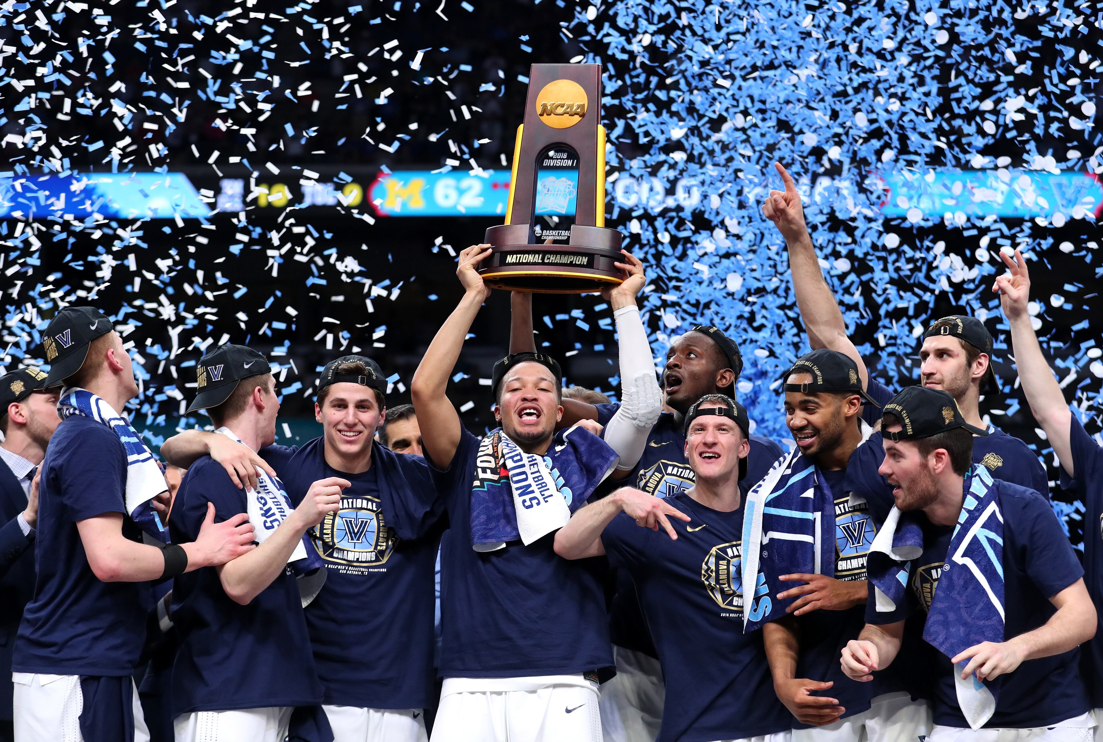 SAN ANTONIO, TX - APRIL 02: Jalen Brunson #1 of the Villanova Wildcats raises the trophy and celebrates with his teammates after defeating the Michigan Wolverines during the 2018 NCAA Men's Final Four National Championship game at the Alamodome on April 2, 2018 in San Antonio, Texas. Villanova defeated Michigan 79-62. (Photo by Tom Pennington/Getty Images)