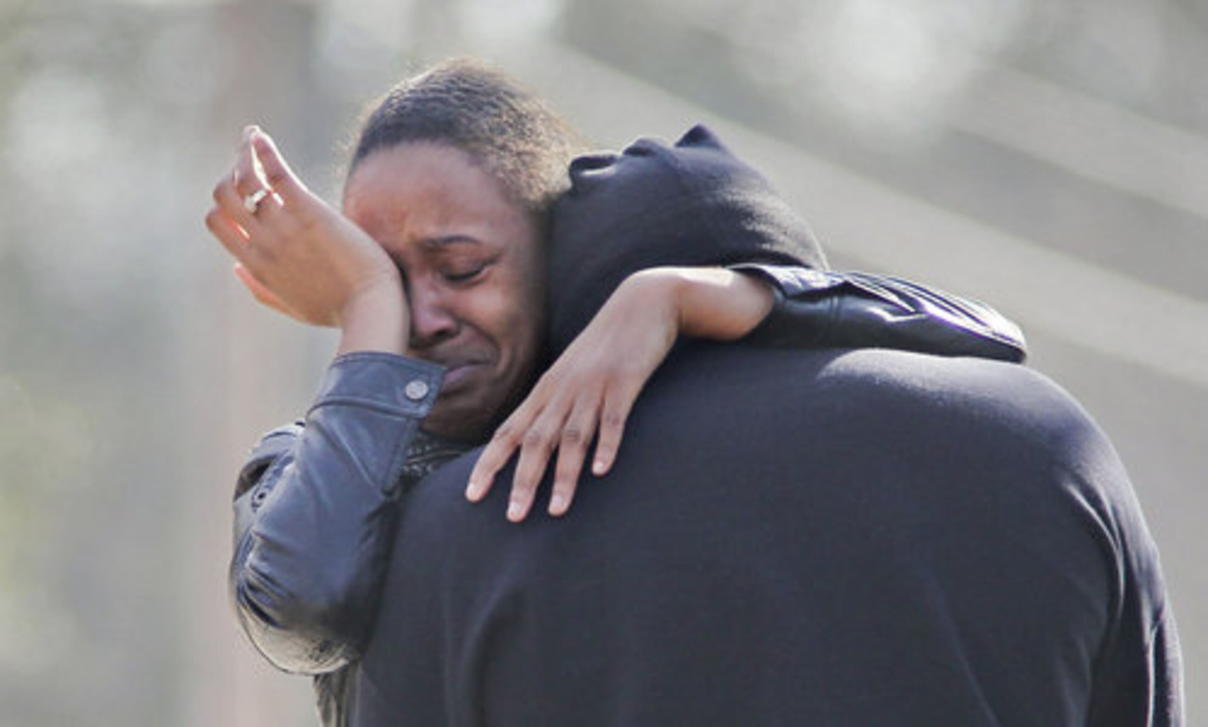 Family and friends of the shooting victims gathered at the scene in grief Tuesday.