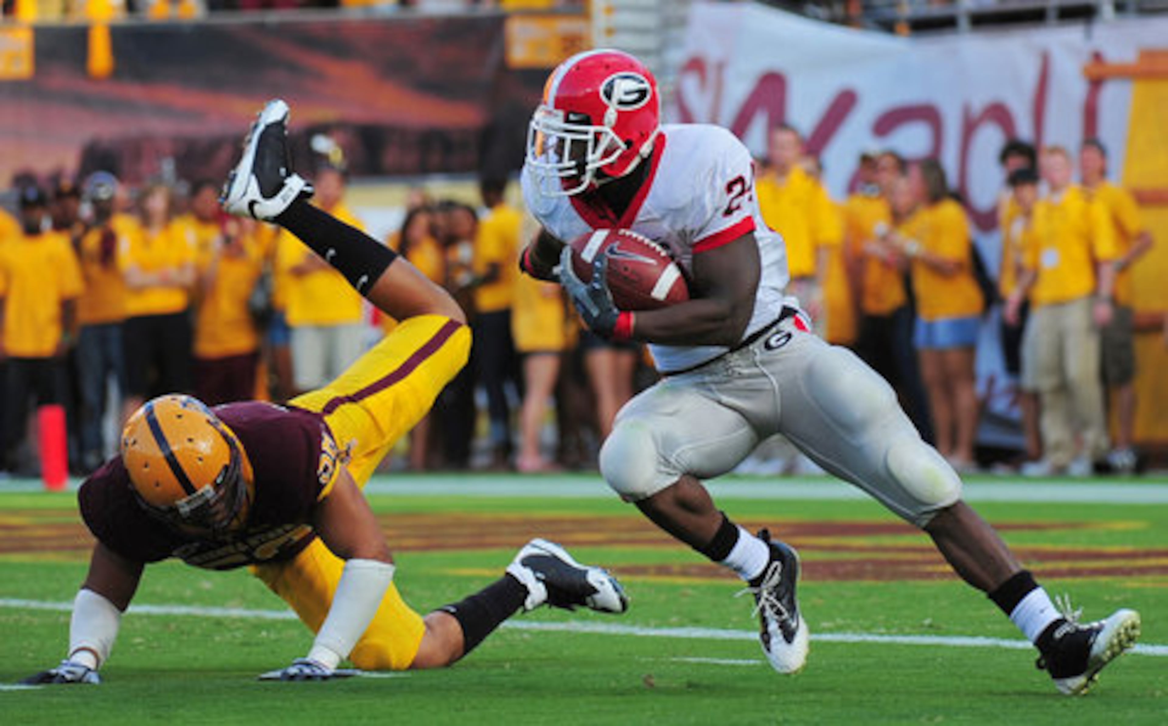 Moreno glides past Arizona State defensive end Dexter Davis. Moreno averaged more than 6 yards per carry in the game.