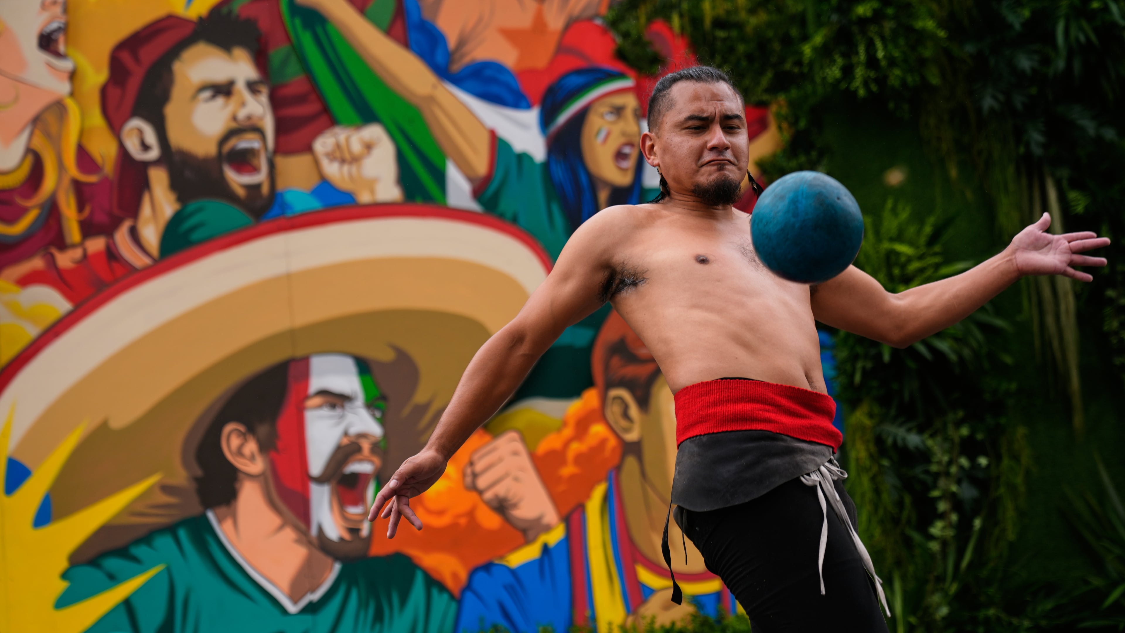 Aztlán Tenochtitlan plays ulama, a traditional Mesoamerican ball game dating back to pre-Hispanic times in Mexico City, Tuesday, June 9, 2026. (AP Photo/Marco Ugarte)