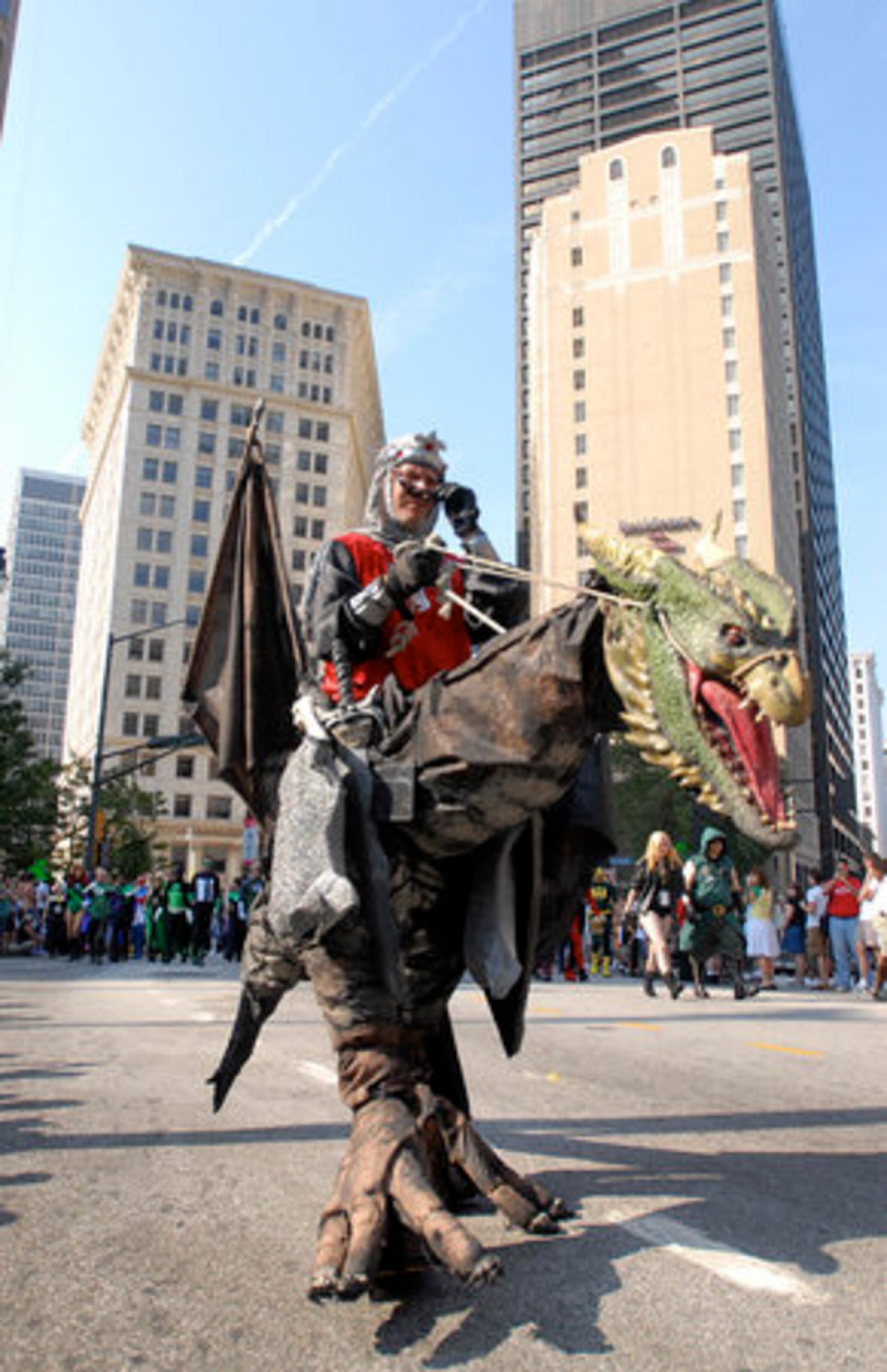 Brian Burk , of Atlanta, adjusts his eyewear while parading down Peachtree Street. Hey, even dragon riders need shades.