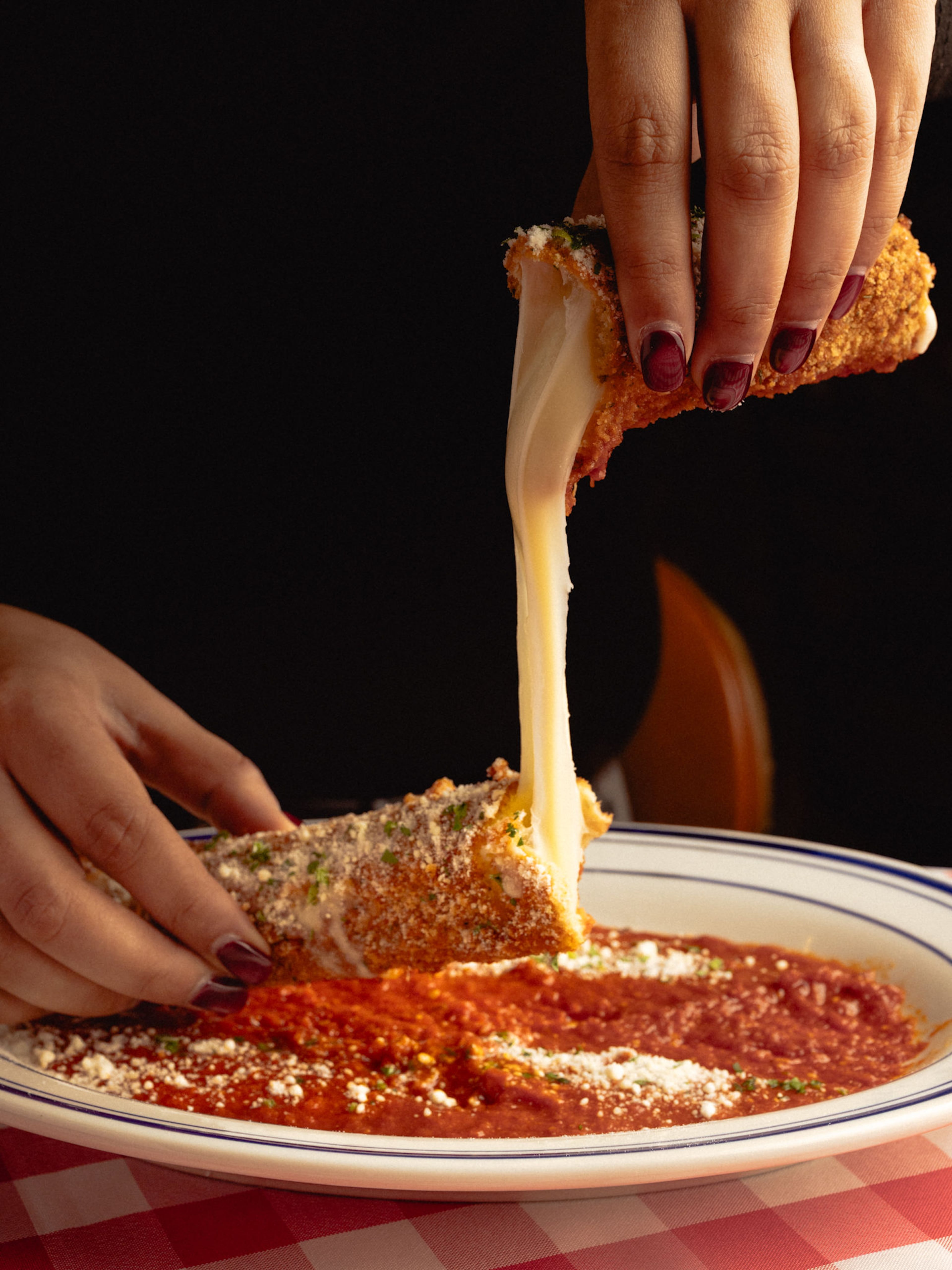 The gargantuan mozzarella stick at Rosso produces an irresistible cheese pull. (Courtesy of Rosso)