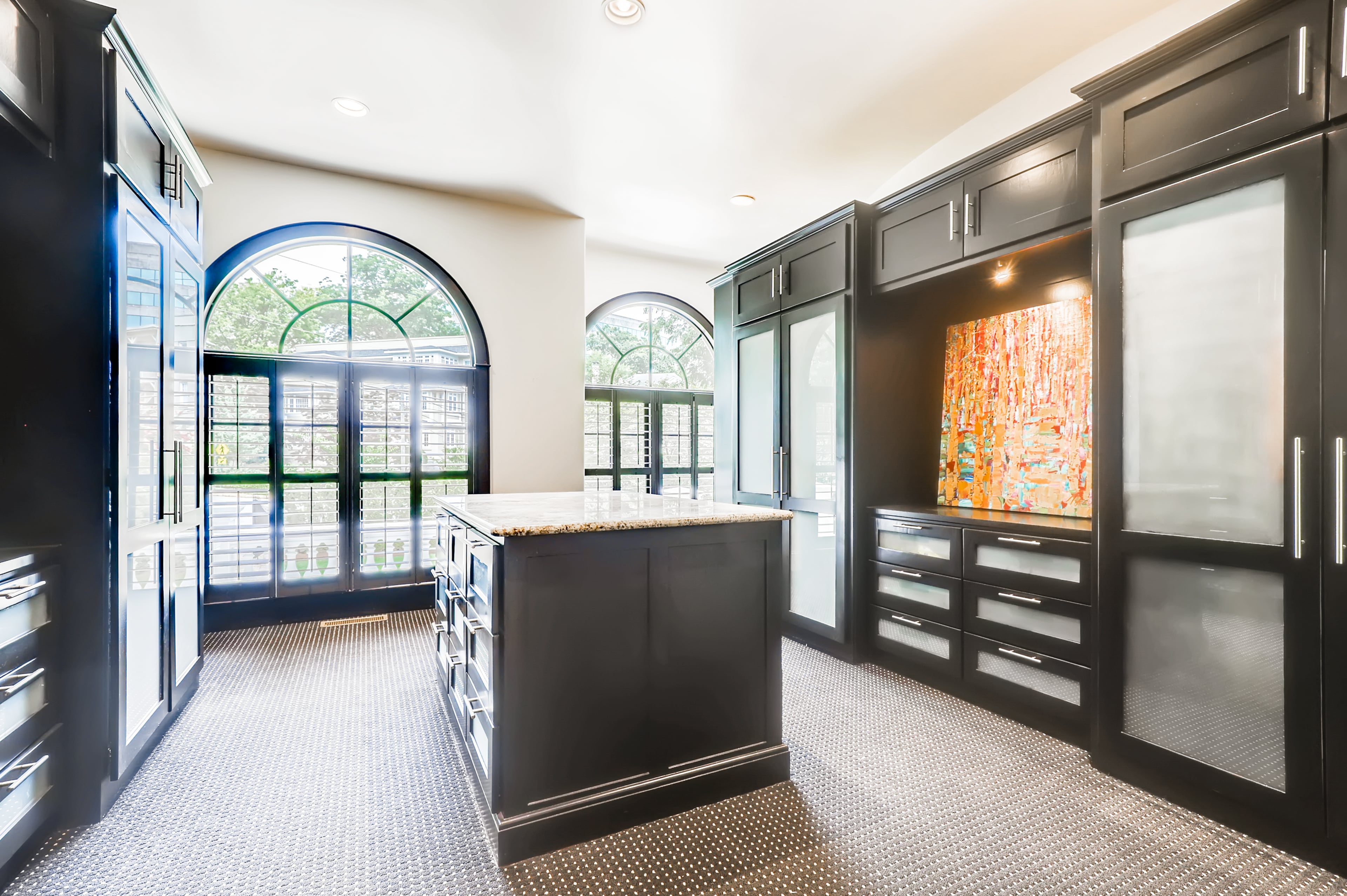 Master closet with packing table and custom cabinetry. Text by Diane Arnold