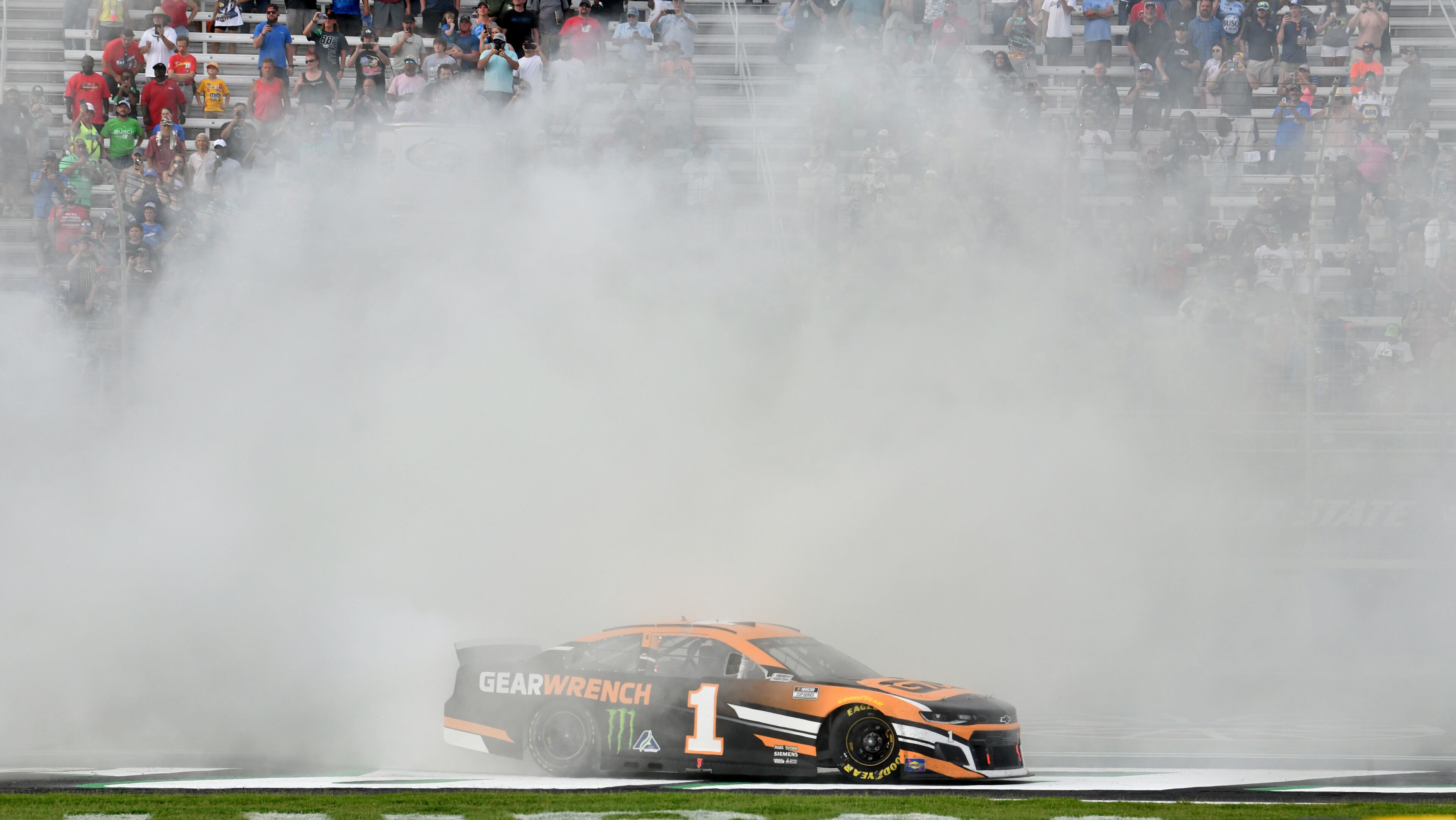 Kurt Busch celebrates with a burnout after winning the Quaker State 400 Presented by Walmart Sunday, July 11, 2021, at Atlanta Motor Speedway in Hampton. (Hyosub Shin / Hyosub.Shin@ajc.com)