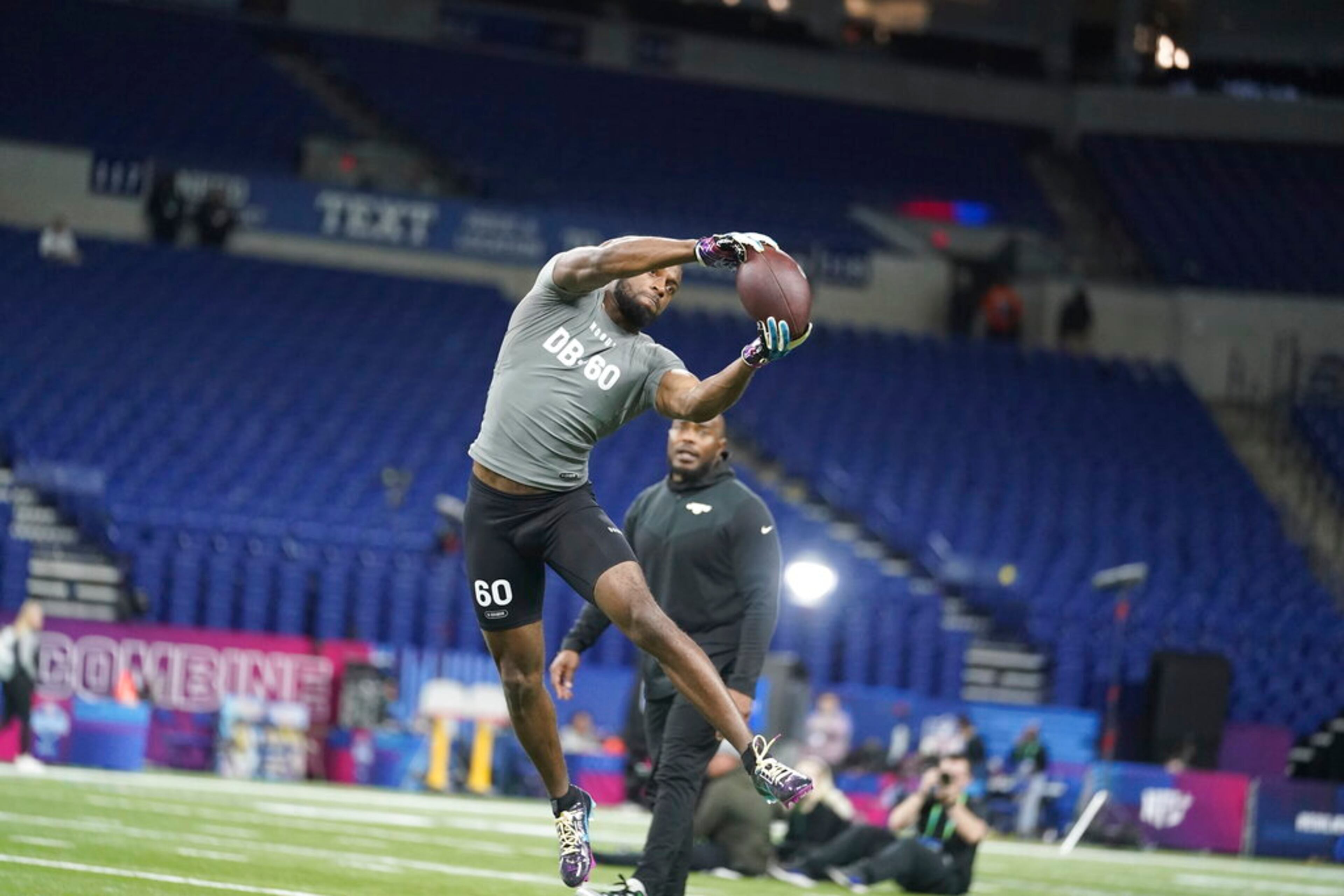 Georgia defensive back Christopher Smith II runs a drill at the NFL football scouting combine in Indianapolis, Friday, March 3, 2023. (AP Photo/Michael Conroy)