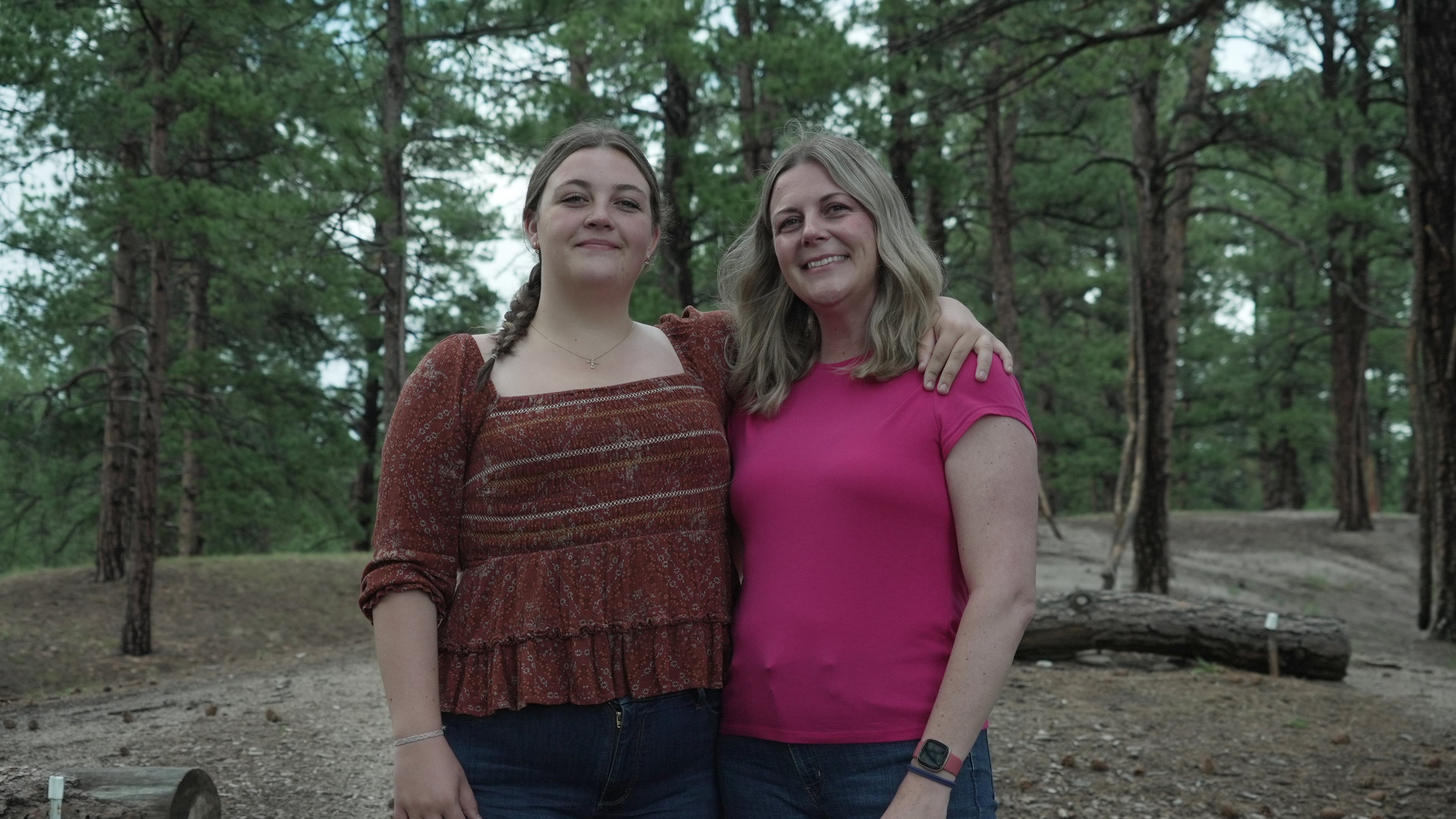 Charlotte Touzalin stands with her mother, Anne Schultz, Friday, July 10, 2026 in Elizabeth, Colo. (AP Photo/Brittany Peterson)