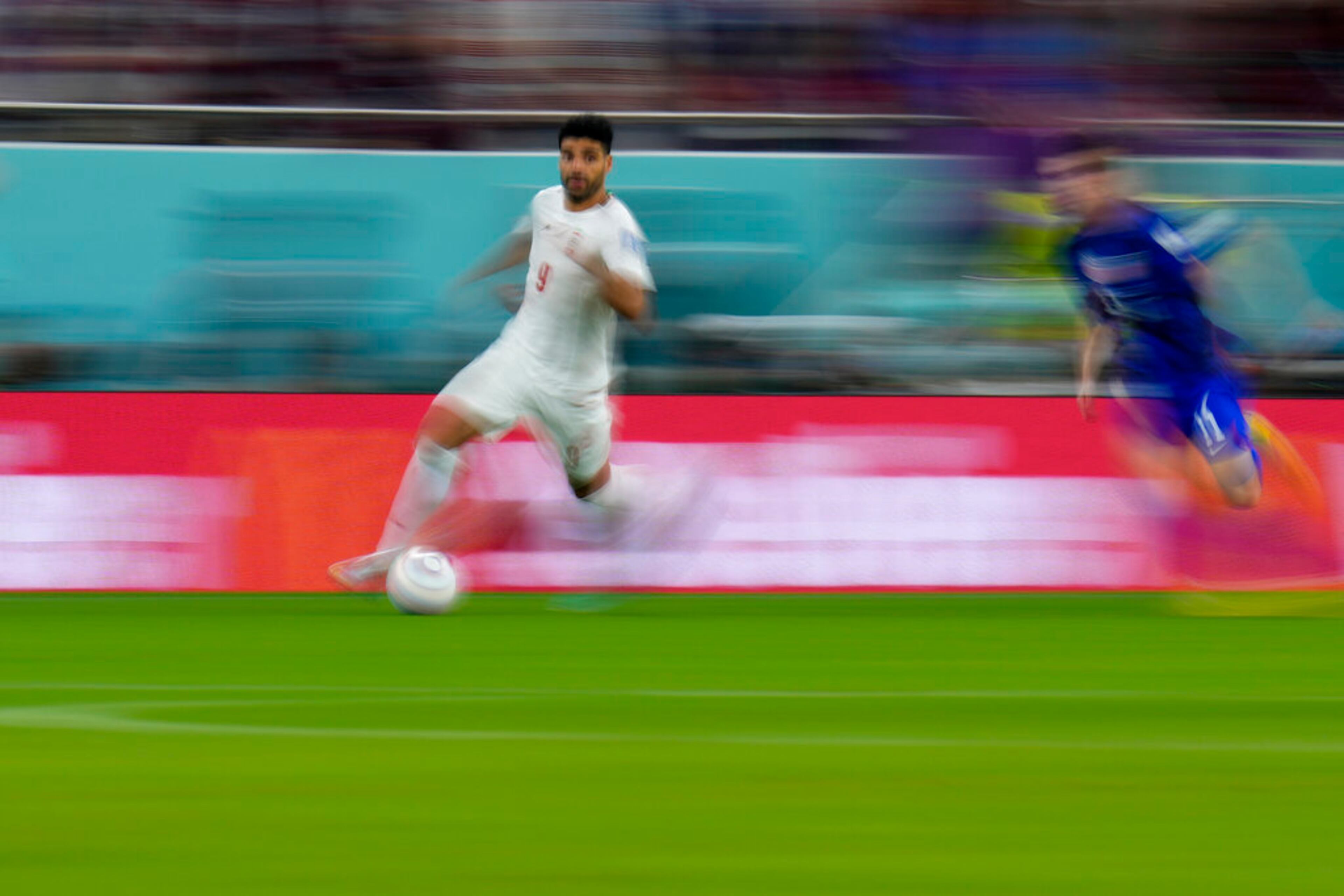 Iran's Mehdi Taremi controls the ball during the World Cup group B soccer match between Iran and the United States at the Al Thumama Stadium in Doha, Qatar, Tuesday, Nov. 29, 2022. (AP Photo/Manu Fernandez)