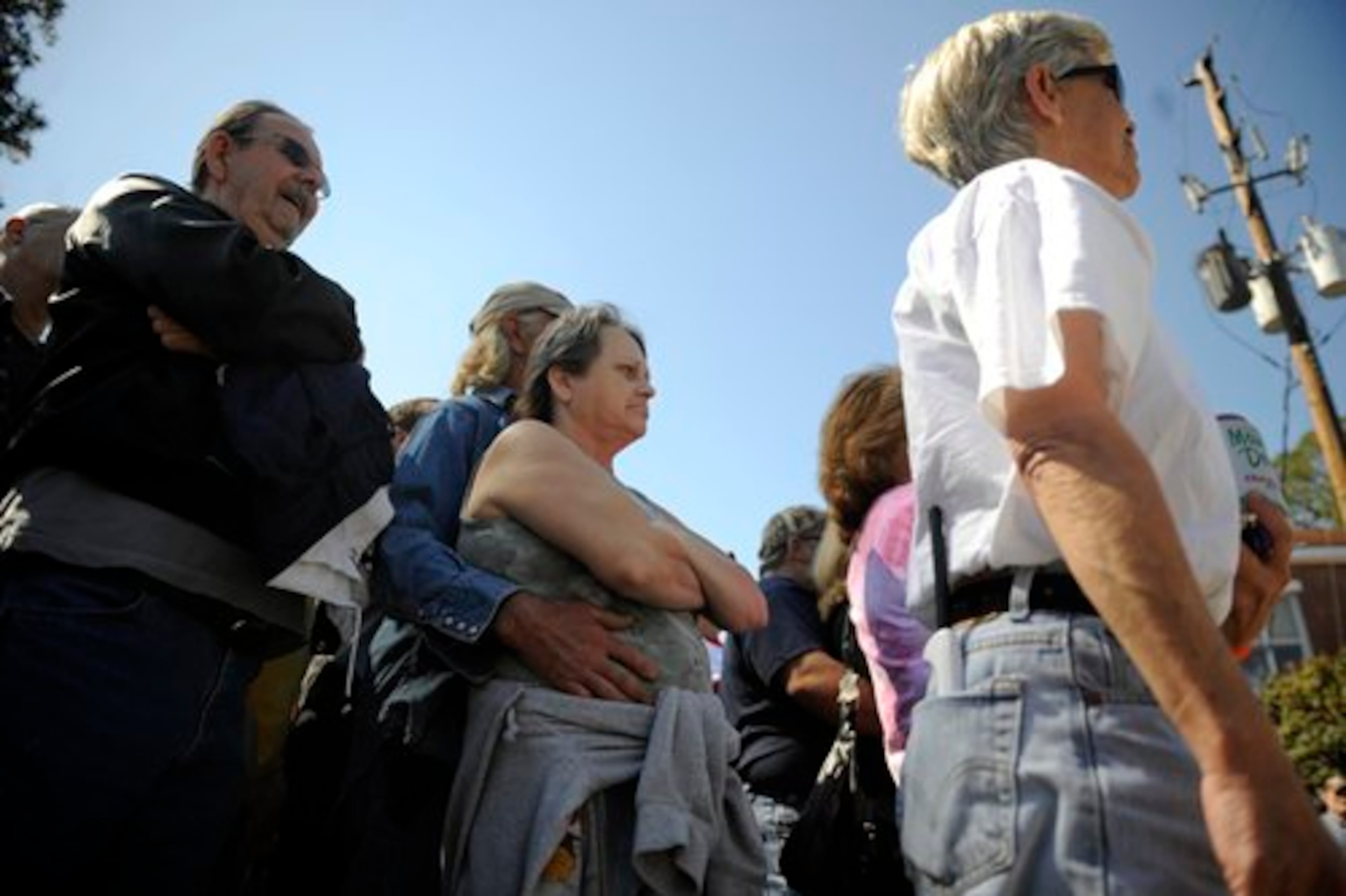 Betty Sellers, 53, of Hortense, Ga listens during the Knight Riders Knights of the Ku Klux Klan rally. Seller clapped in support for much of the talk.