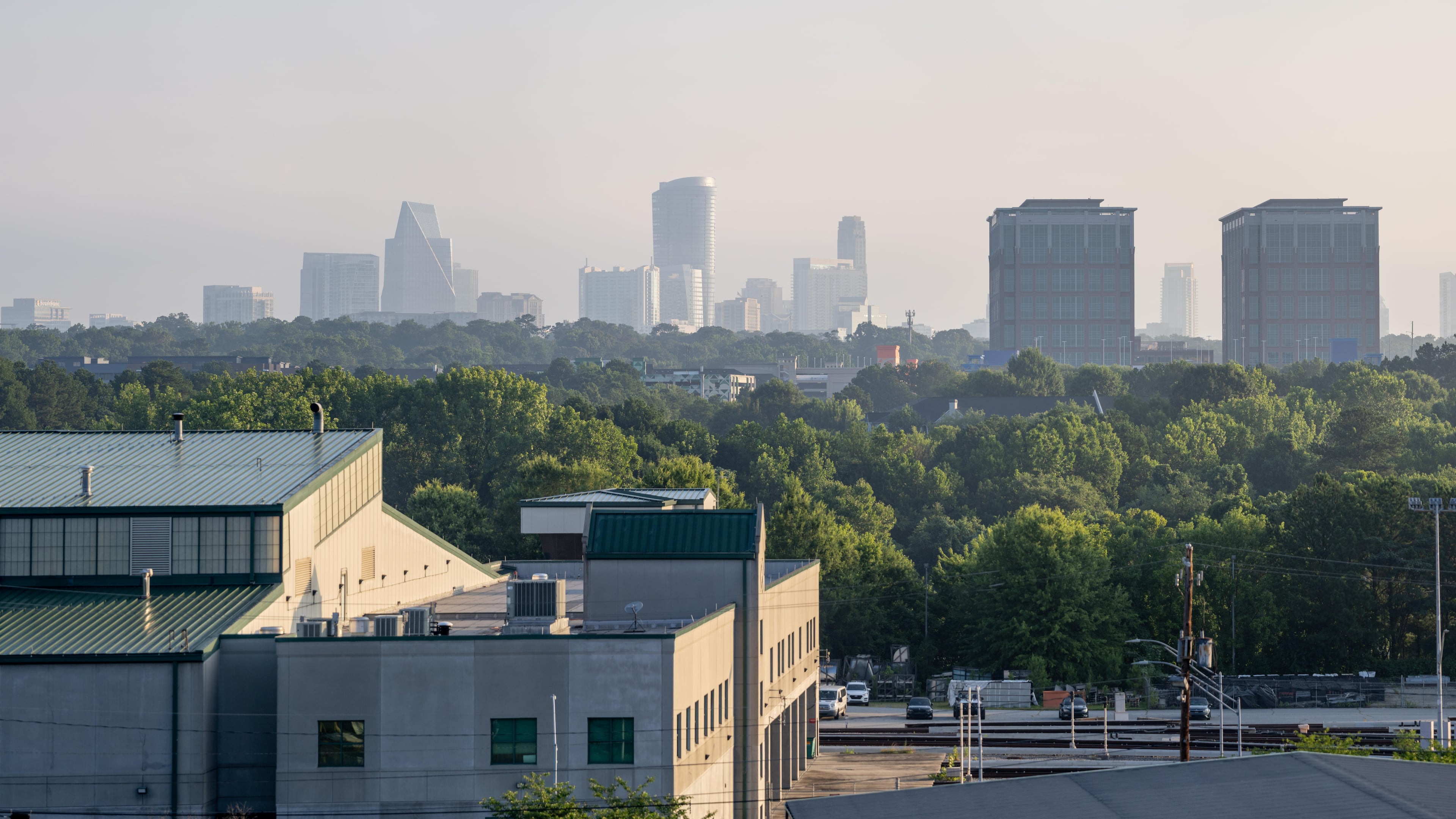 Atlanta's trees and skyline are shown in June 2025. (Ben Hendren for the AJC)