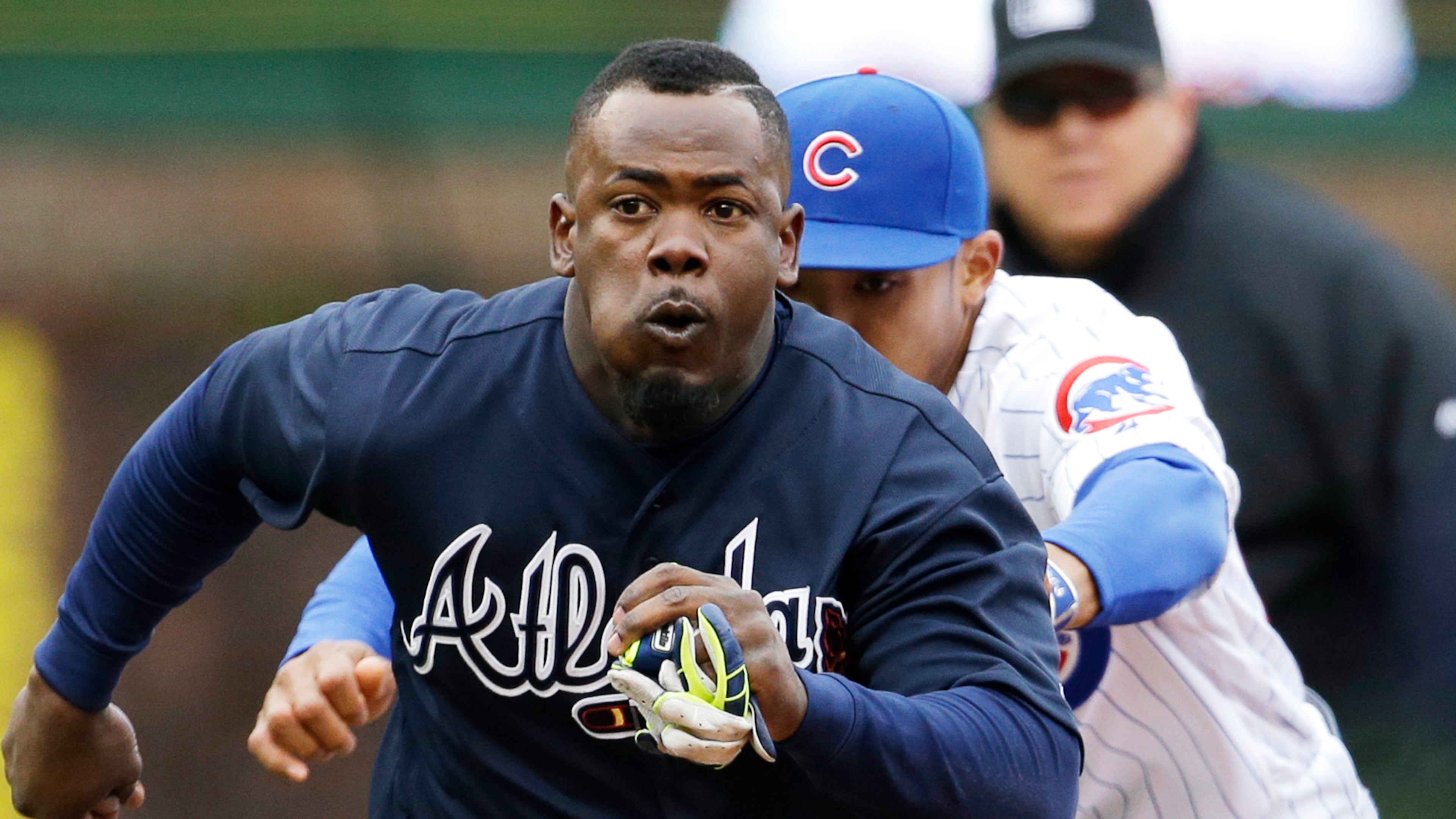 Atlanta Braves' Adonis Garcia is tagged out by Chicago Cubs shortstop Addison Russell during the sixth inning of a baseball game, Sunday, May 1, 2016, in Chicago. (AP Photo/Nam Y. Huh)