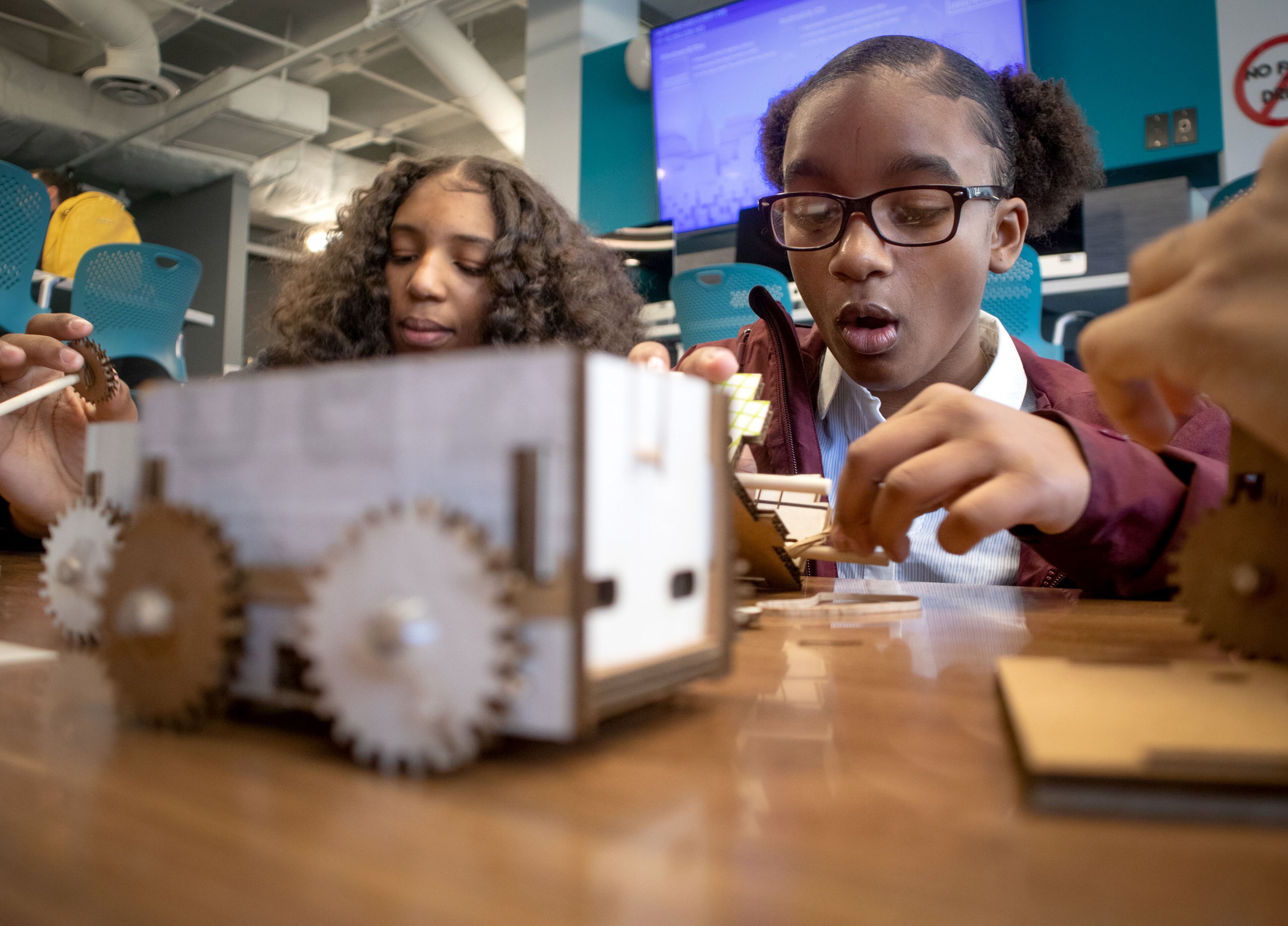 Alianna Thiam (left) works on her rubberband-powered car project during the Genius Camp in the ExLab at Georgia State University on Saturday, March 7, 2020. The event was among activities held around the area as part of this year's Atlanta Science Festival. (Photo: STEVE SCHAEFER / SPECIAL TO THE AJC)