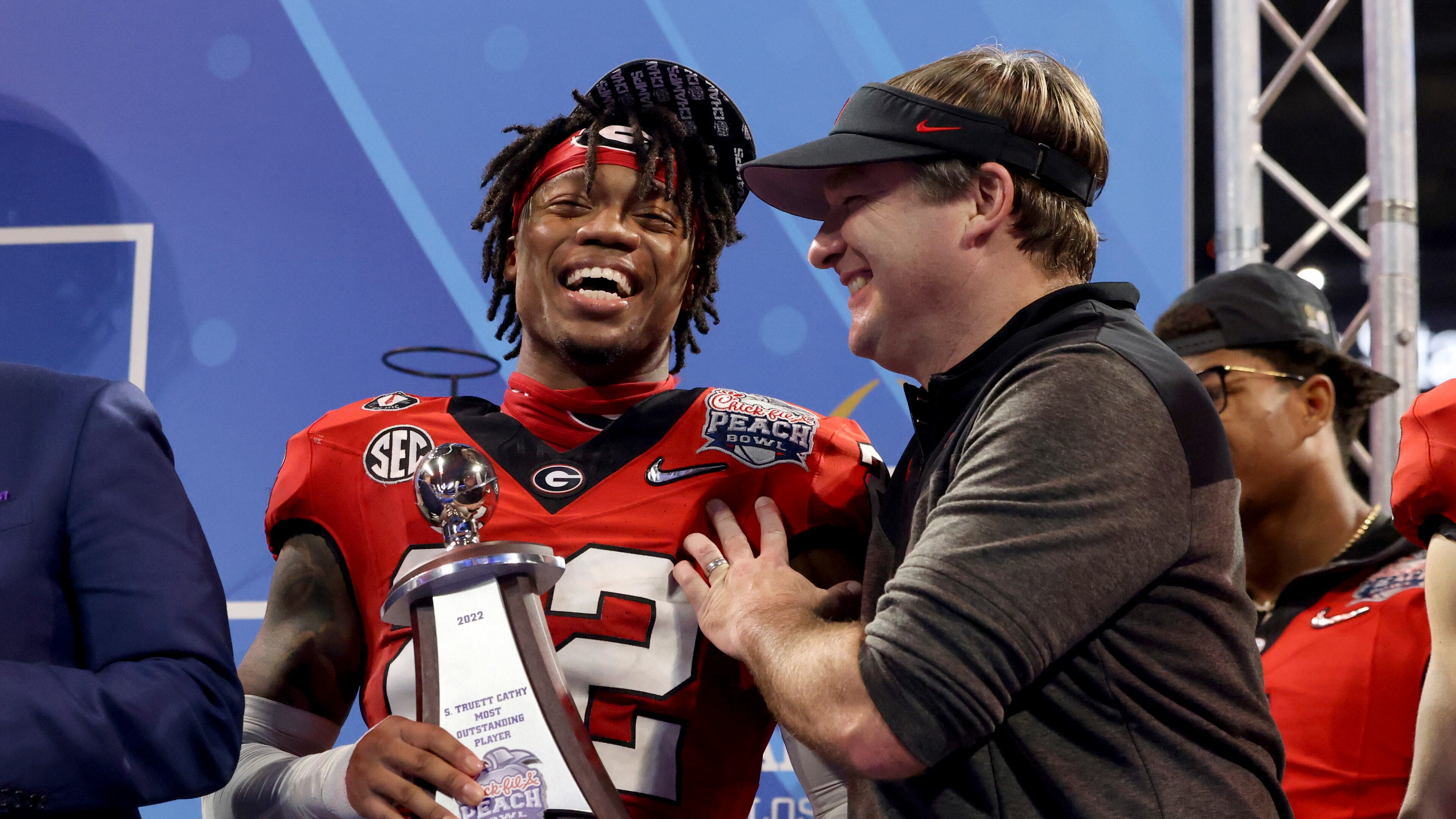 Georgia head coach Kirby Smart celebrates with defensive MVP defensive back Javon Bullard after Georgia’s 42-41 win against Ohio State in the Peach Bowl Playoff Semifinal, at Mercedes-Benz Stadium, Sat., Dec. 31, 2022, in Atlanta. (Jason Getz / Jason.Getz@ajc.com)