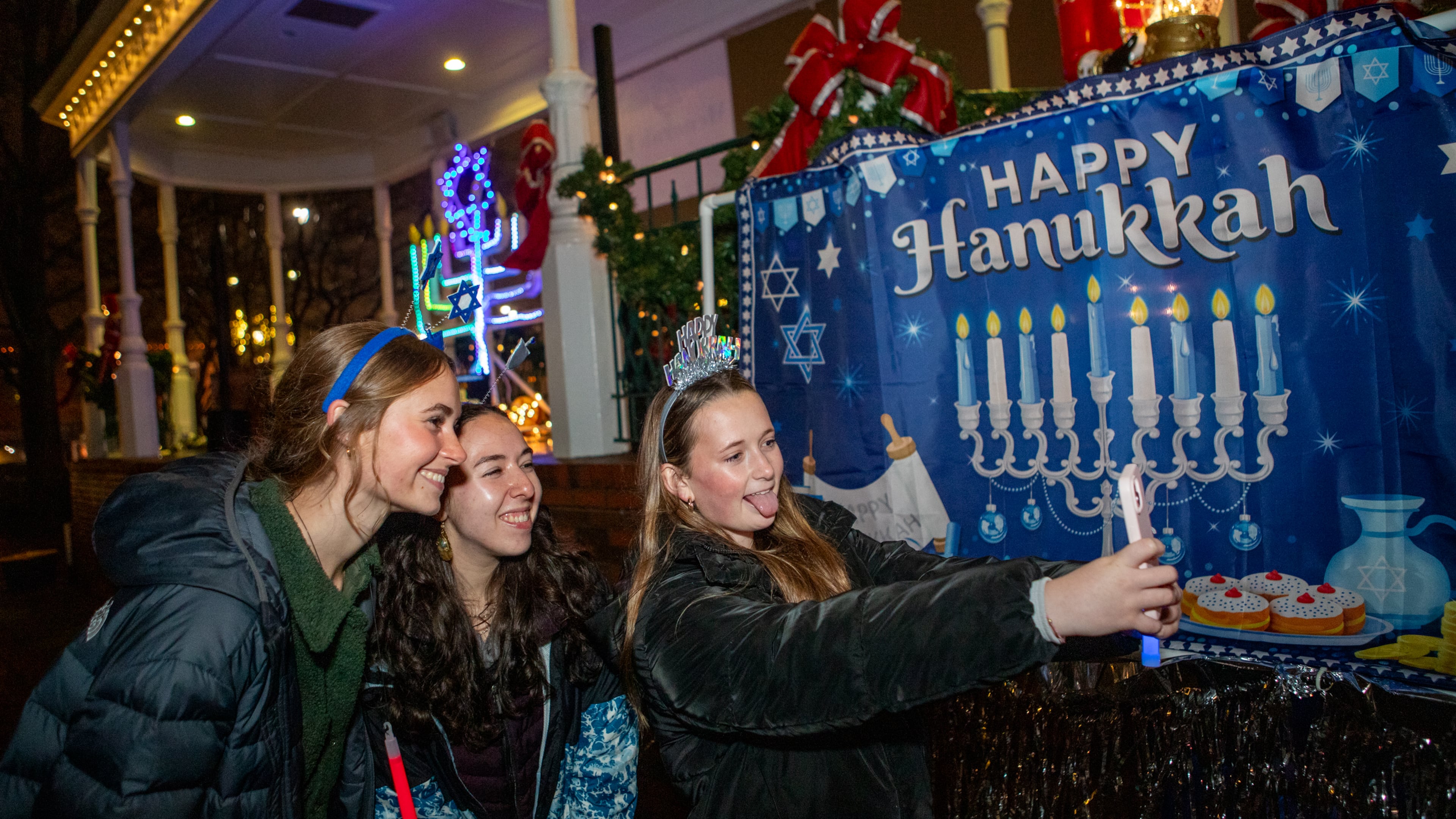 Congregation Ner Tamid hosts a menorah lighting on the fifth night of Hanukkah in Marietta Square on Saturday, Dec 28, 2024. The Kennesaw-based temple will host a menorah lighting for the 11th time in the square this year. (Jenni Girtman for the AJC)
