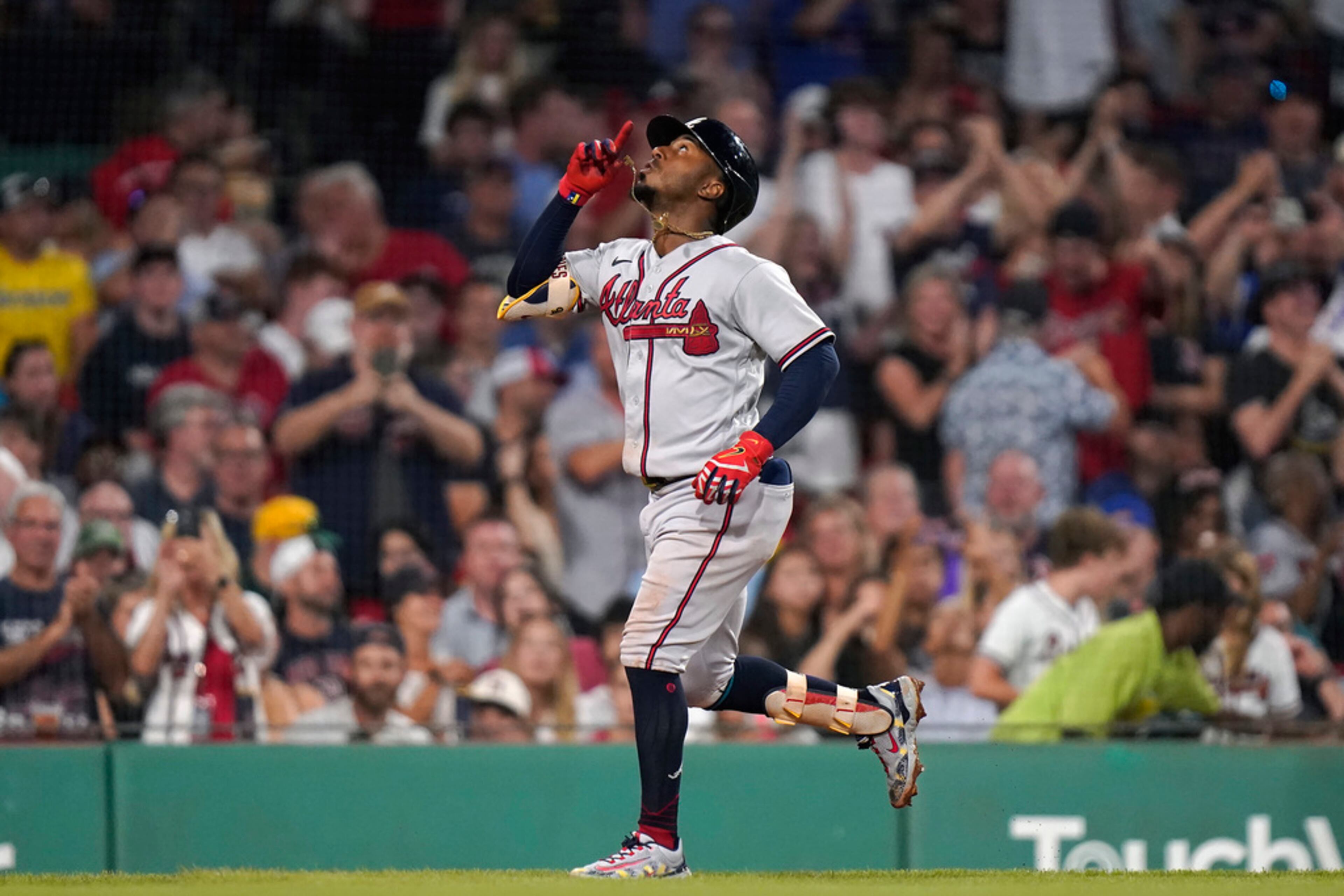 Atlanta Braves' Ozzie Albies looks up as he runs toward home after hitting a three-run home run in the sixth inning of a baseball game against the Boston Red Sox, Wednesday, July 26, 2023, in Boston. (AP Photo/Steven Senne)