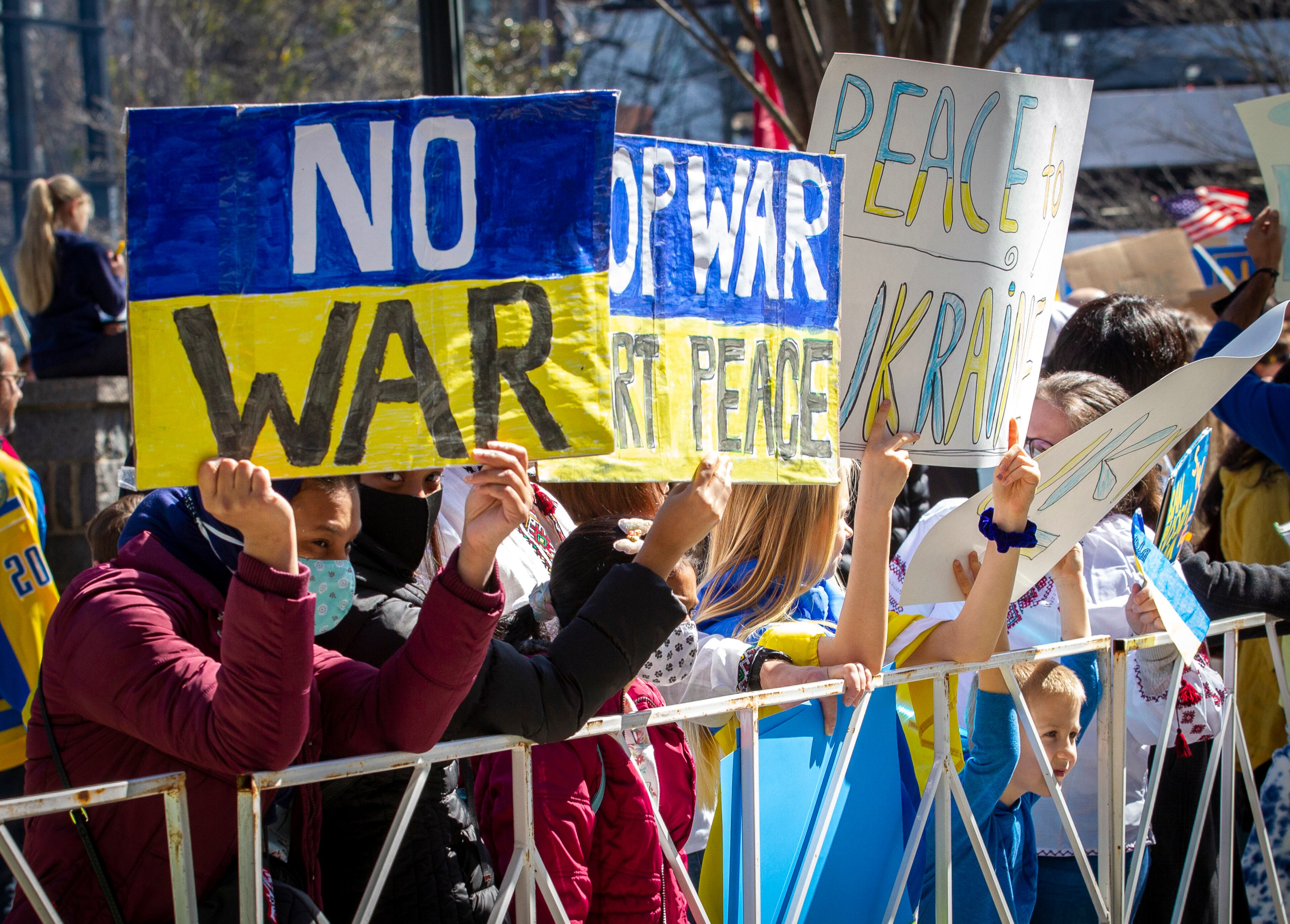 People show their support for Ukraine during a rally outside Centennial Olympic Park on Saturday, February 26, 2022. STEVE SCHAEFER FOR THE ATLANTA JOURNAL-CONSTITUTION