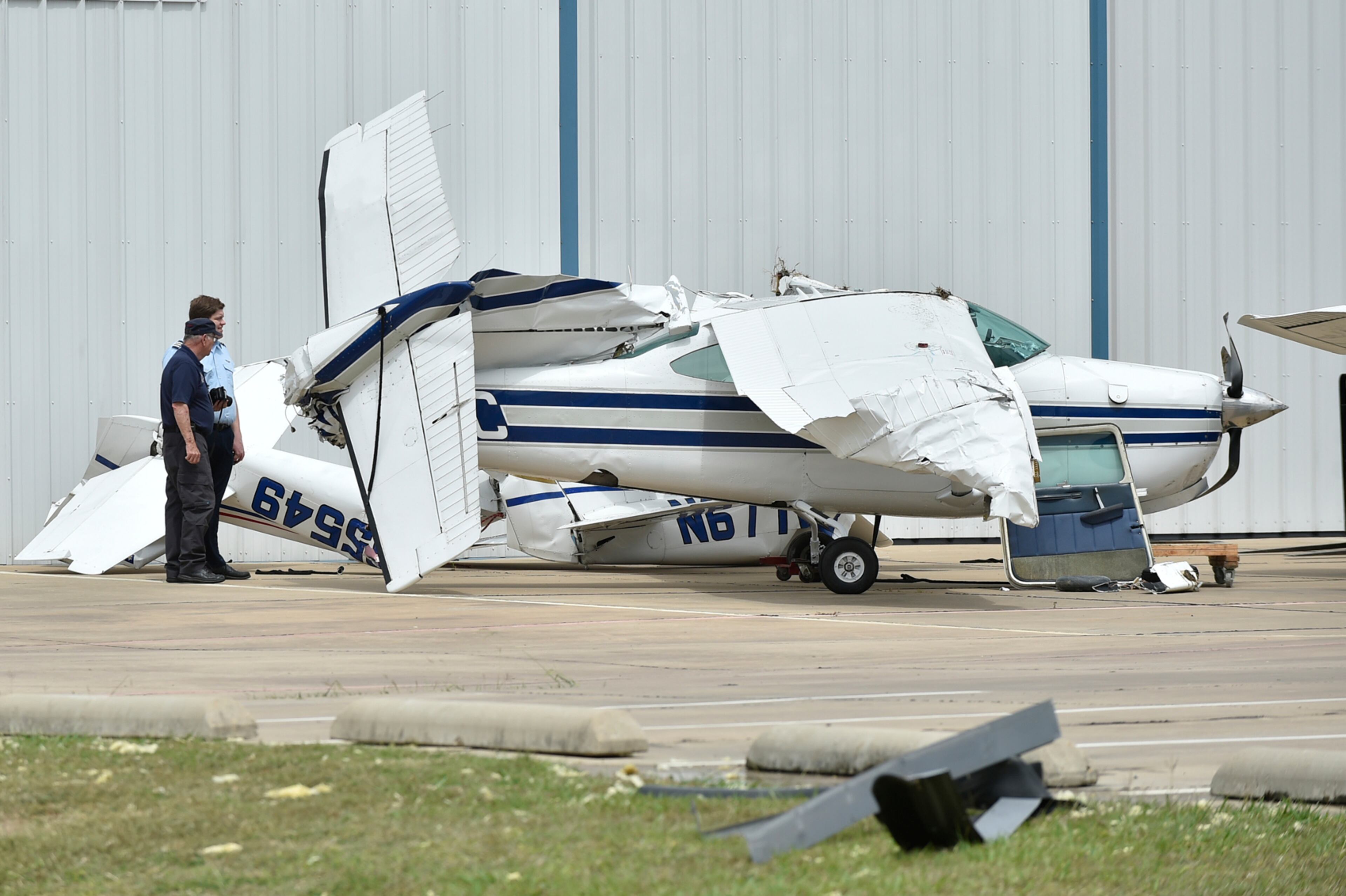A small plane sustained damage during an overnight storm at Denton Enterprise Airport, Tuesday, May 23, 2017, in Denton, Texas. Authorities say more than a dozen small planes have been damaged as storms packing strong winds struck the North Texas airport. (Jeff Woo/The Denton Record-Chronicle via AP)