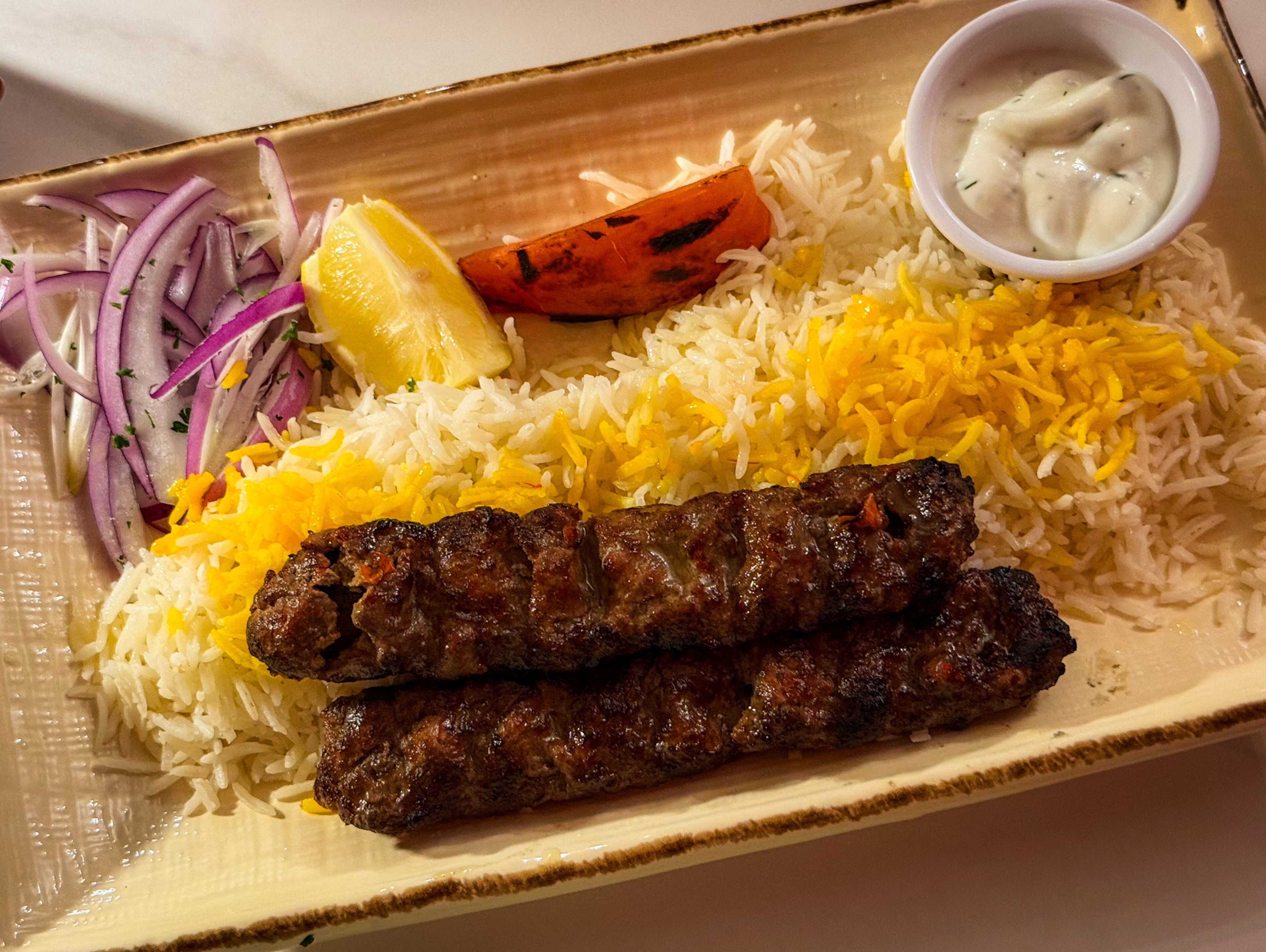 The adana kebab at Banu Mediterranean Grill is juicy and perfectly roasted. (Henri Hollis/henri.hollis@ajc.com)