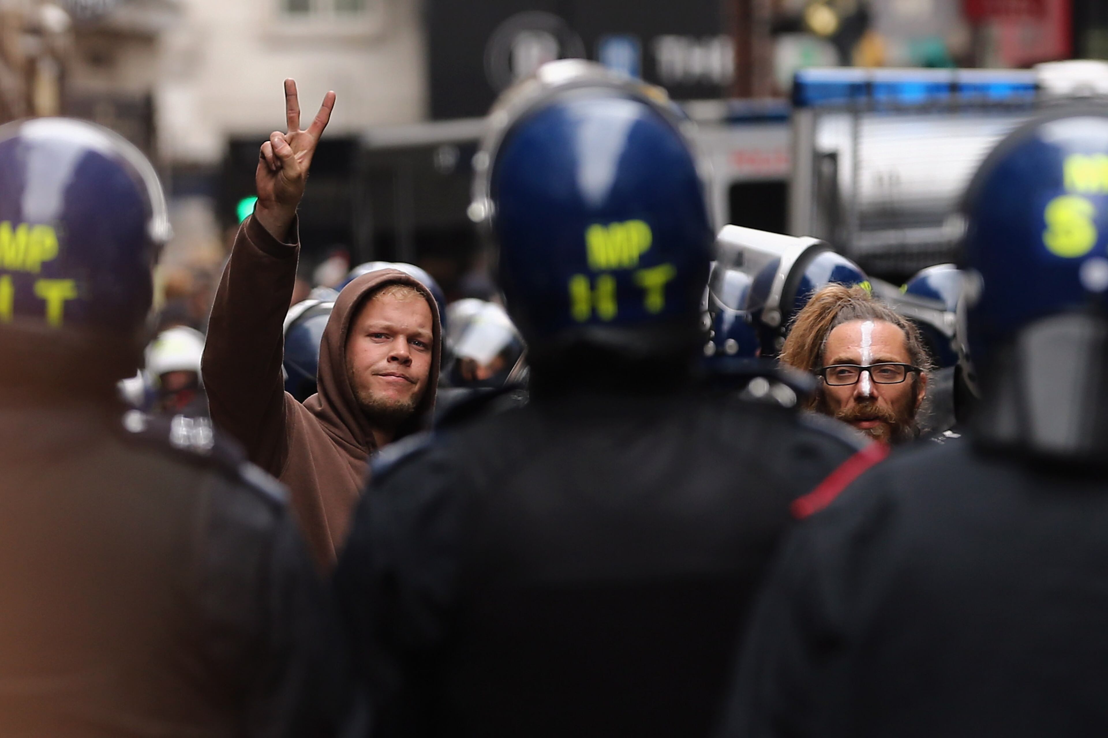 Protesters are led from a building they had been occupying on Beak Street in Soho, as part of a protest ahead of next week's G8 summit in Northern Ireland on June 11, 2013 in London, England. Next week will see Enniskillen in Northern Ireland host the two day G8 summit where international leaders including Britain's Prime Minister David Cameron and US President Barack Obama take part in the two day event. The chosen location is only 8 kilometers from the scene of one of Northern Ireland's worst killings back in 1987, however Cameron is confident that it's secluded location will deter any potential trouble. (Photo by Dan Kitwood/Getty Images)