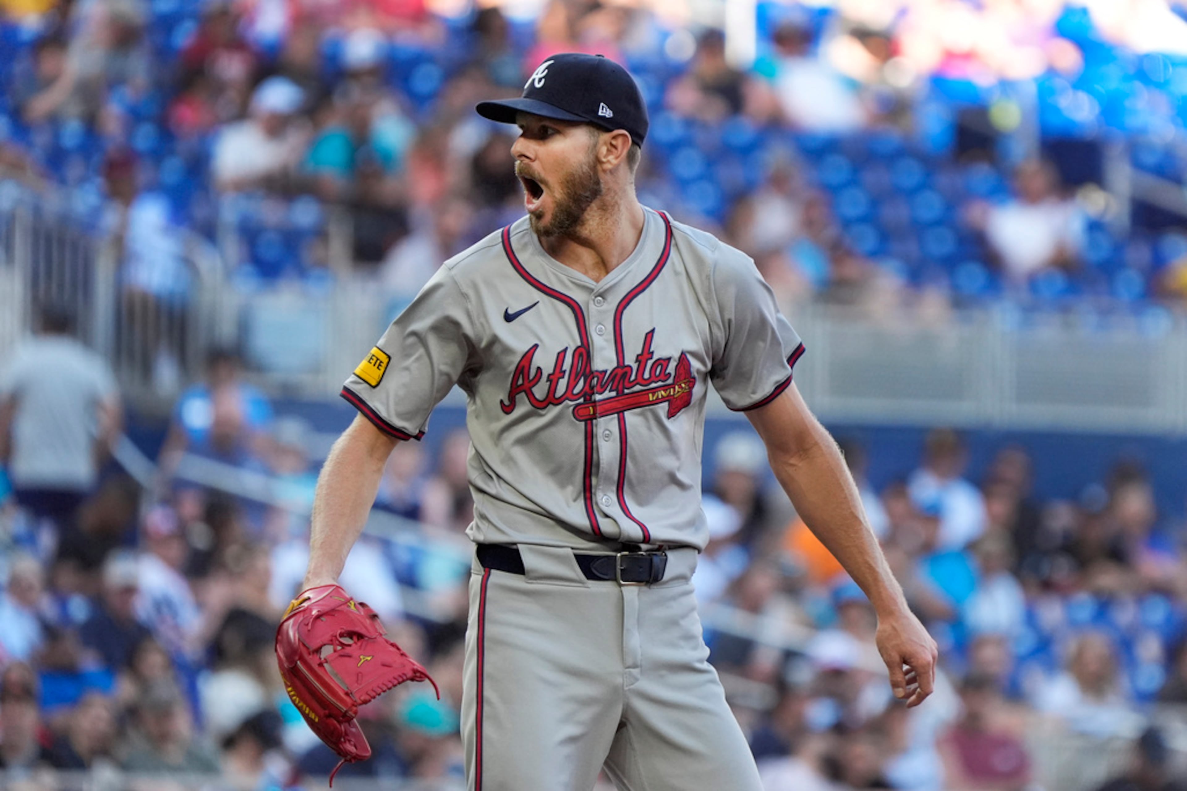 Atlanta Braves starting pitcher Chris Sale reacts after walking Miami Marlins' Jake Burger during the fifth inning of a baseball game, Saturday, April 13, 2024, in Miami. Miami won 5-1. (AP Photo/Wilfredo Lee)