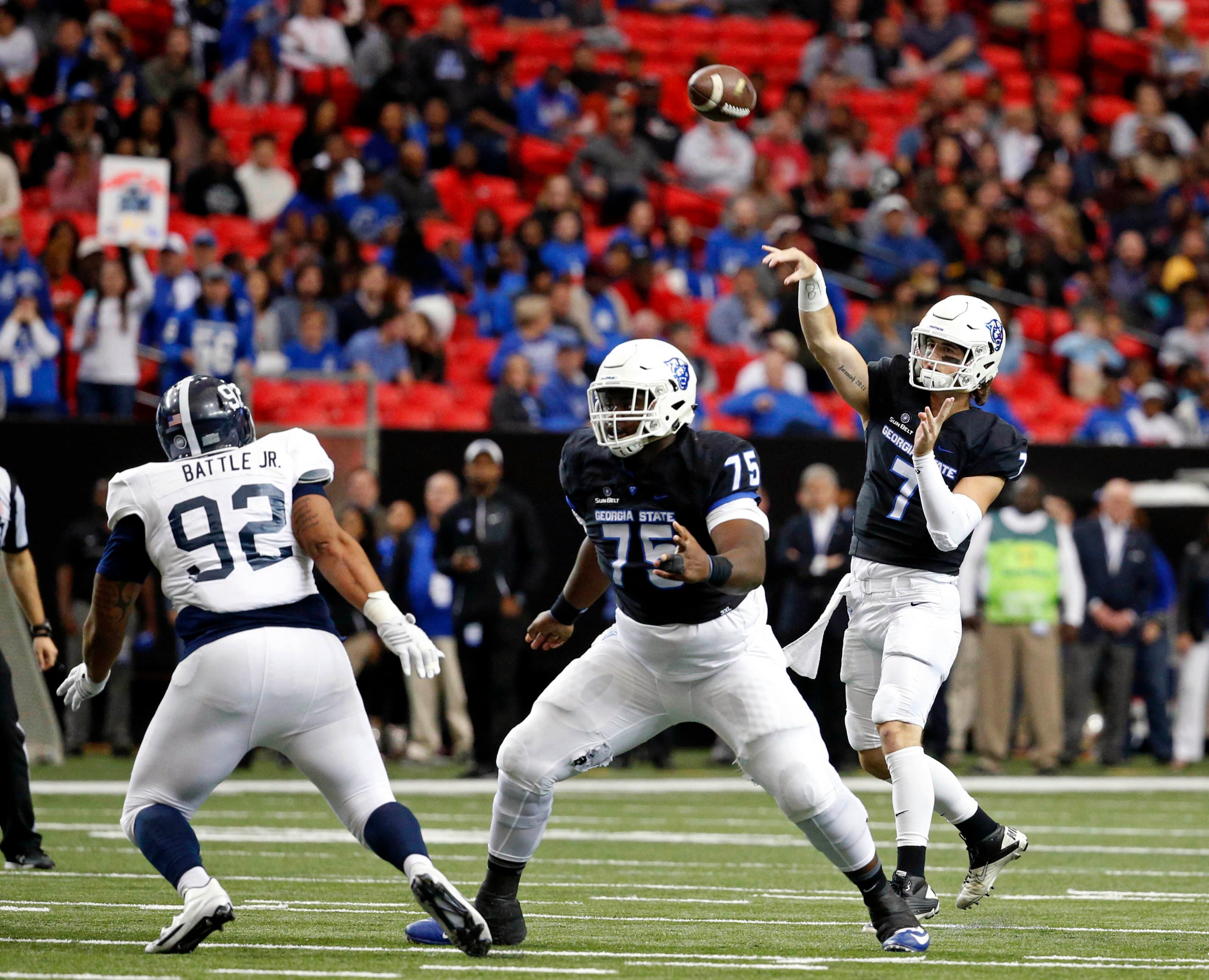 November 19, 2016 - Atlanta, Ga: Georgia State Panthers quarterback Conner Manning (7) attempts a pass as offensive tackle Michael Ivory (75) blocks Georgia Southern Eagles defensive lineman Jonathan Battle Jr. (92) in the first half of their game at the Georgia Dome Saturday November 19, 2016, in Atlanta, Ga. PHOTO / JASON GETZ