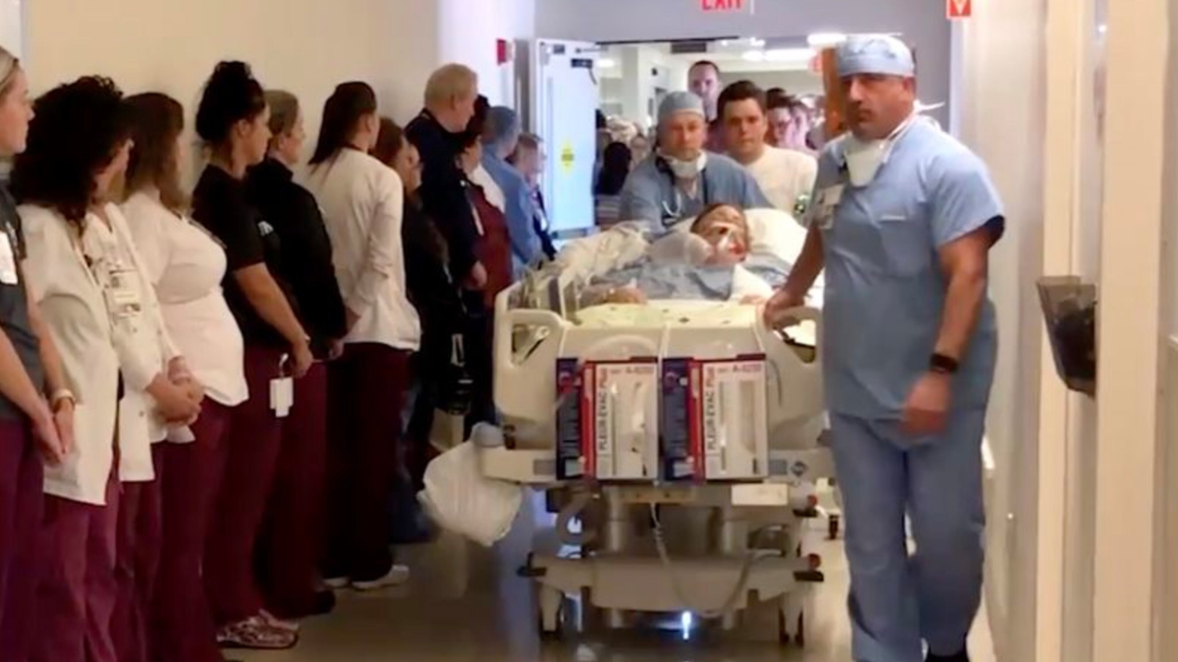 Screenshot of UPMC Hamlot video shows line of hospital employees honoring late nurse Mary Desin.