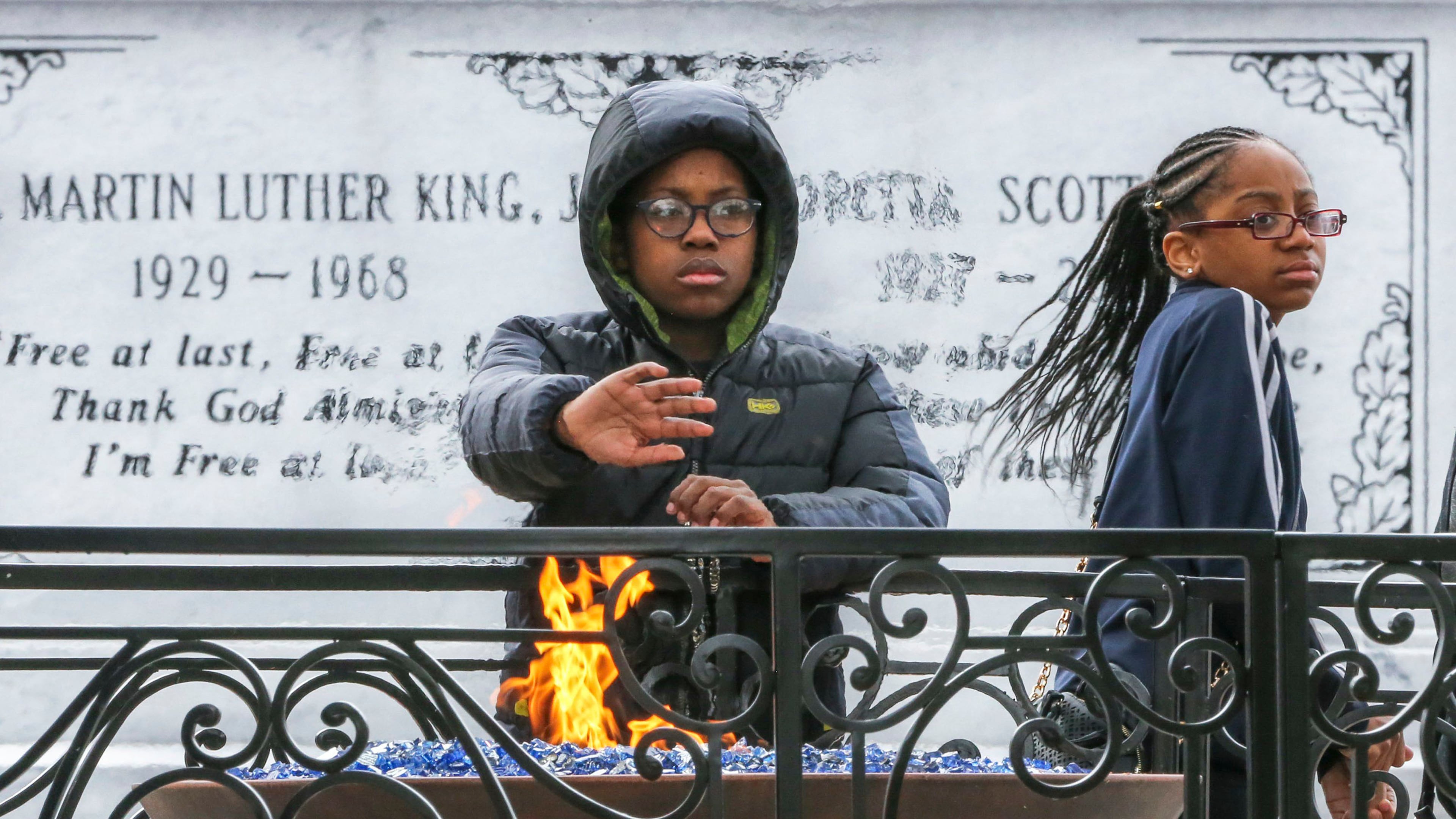 Malik Shaeer, 12, left, and Deja Reynolds, 12, from Minneapolis, visit the crypt of Martin Luther King Jr. and Coretta Scott King in Atlanta. (John Spink/The Atlanta Journal-Constitution/TNS)