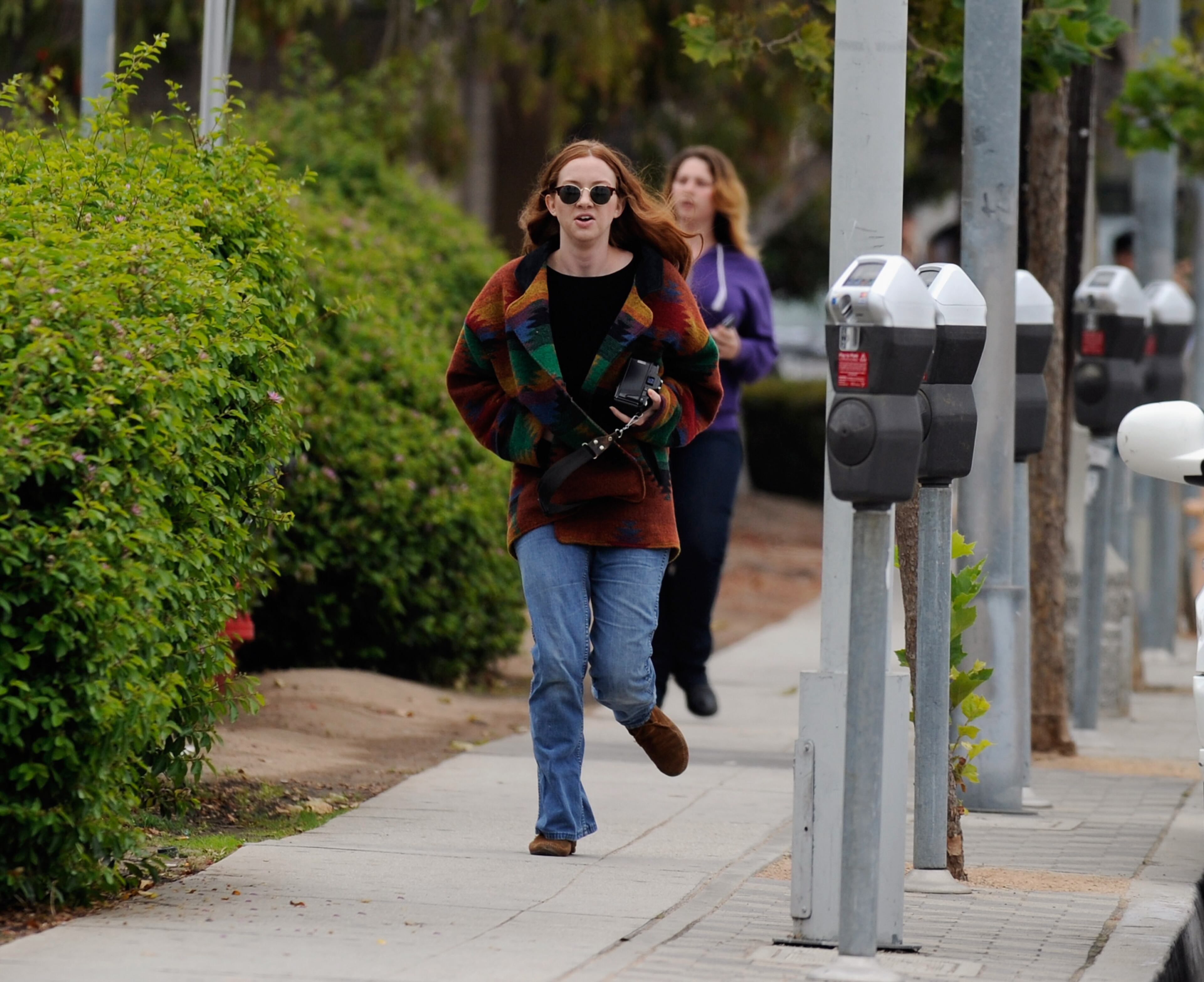 SANTA MONICA, CA - JUNE 07: Students rush to safety after shots were fired near the Santa Monica College on June 7, 2013 in Santa Monica, California. According to reports, at least three people have been injured, and a suspect was taken into custody. (Photo by Kevork Djansezian/Getty Images)