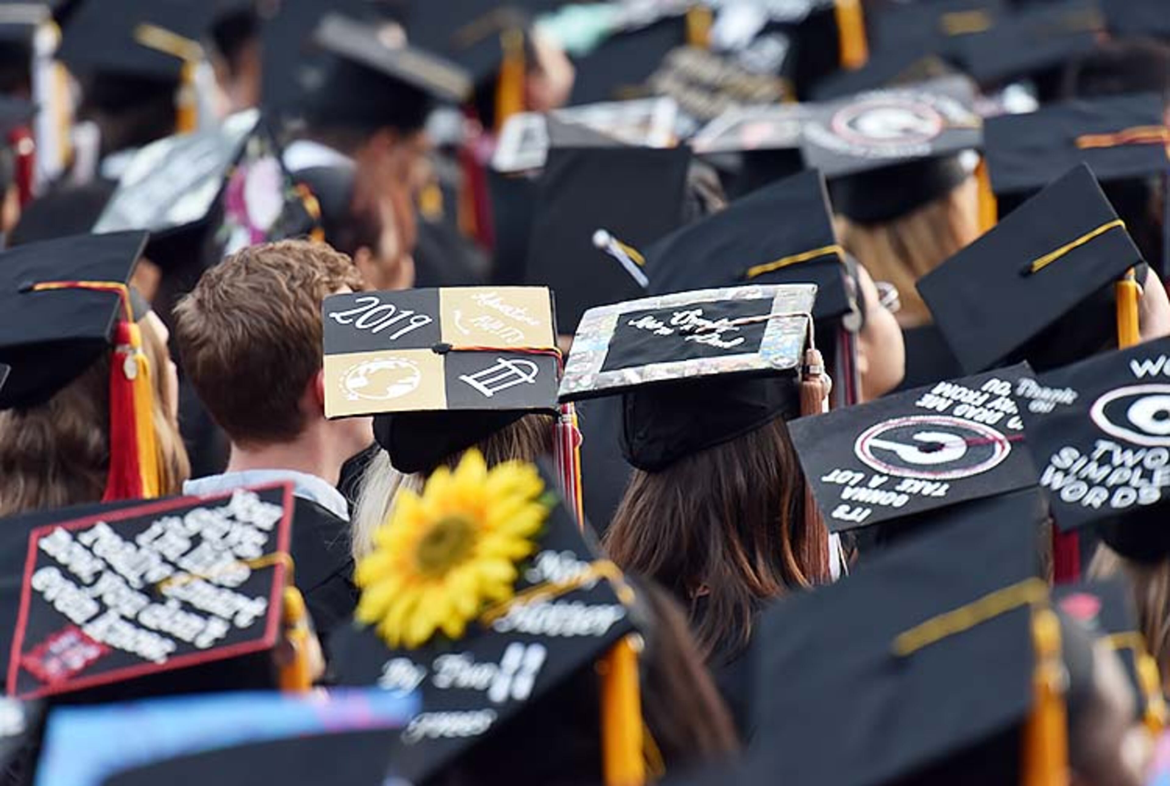 May 10, 2019 Athens - University of Georgia students personalized their mortar boards during 2019 spring undergraduate commencement ceremony at Sanford Stadium in Athens on Friday, May 10, 2019. HYOSUB SHIN / HSHIN@AJC.COM