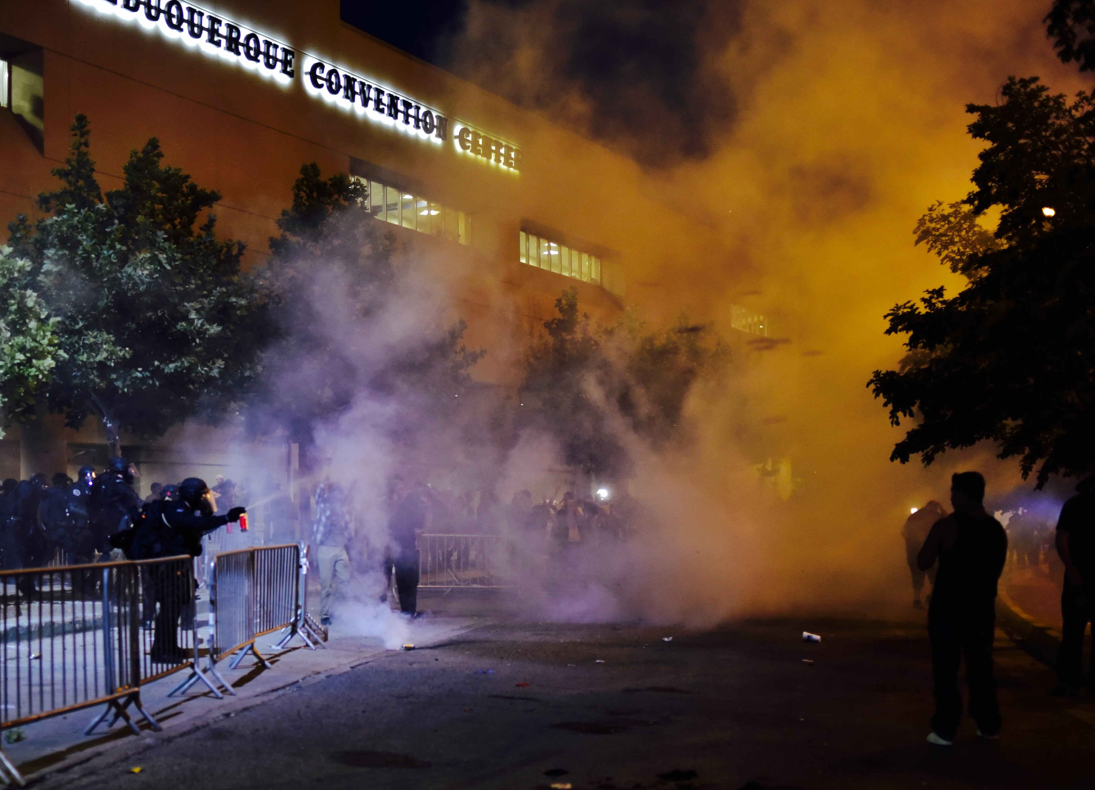 Pepper spray is deployed at protestors of Republican presidential hopeful Donald Trump at the Albuquerque Convention Center after the Trump rally in Albuquerque, N.M., Tuesday, May 24, 2016. (Roberto E. Rosales/The Albuquerque Journal via AP)